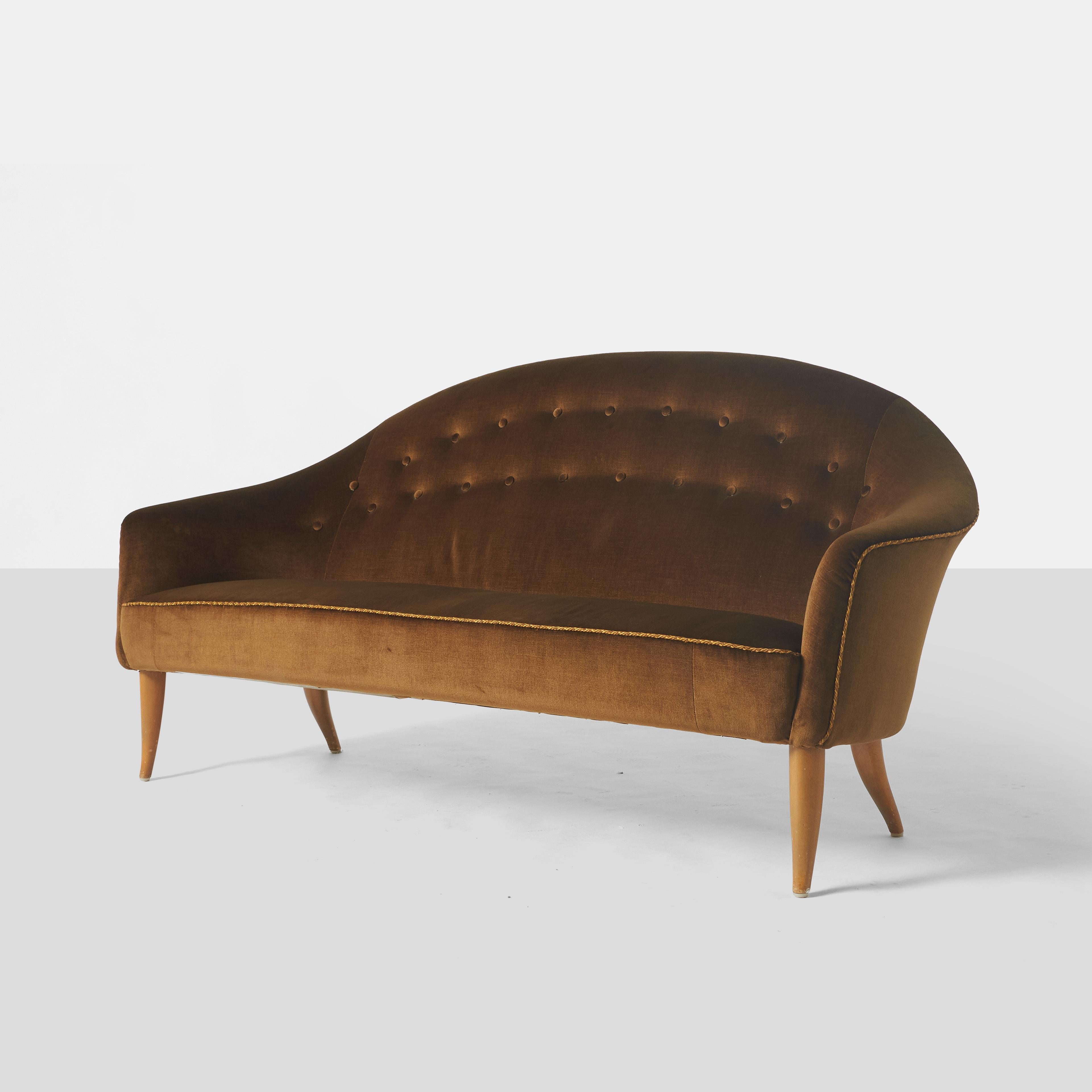 A tufted sofa from the Paradise collection by Kerstin Horlin-Holmquist for Nordiska Kompaniet with beech legs and upholstered in a brown sateen velvet with a twisted cord trim detail along the seat and back edges.

Matching high back and low back