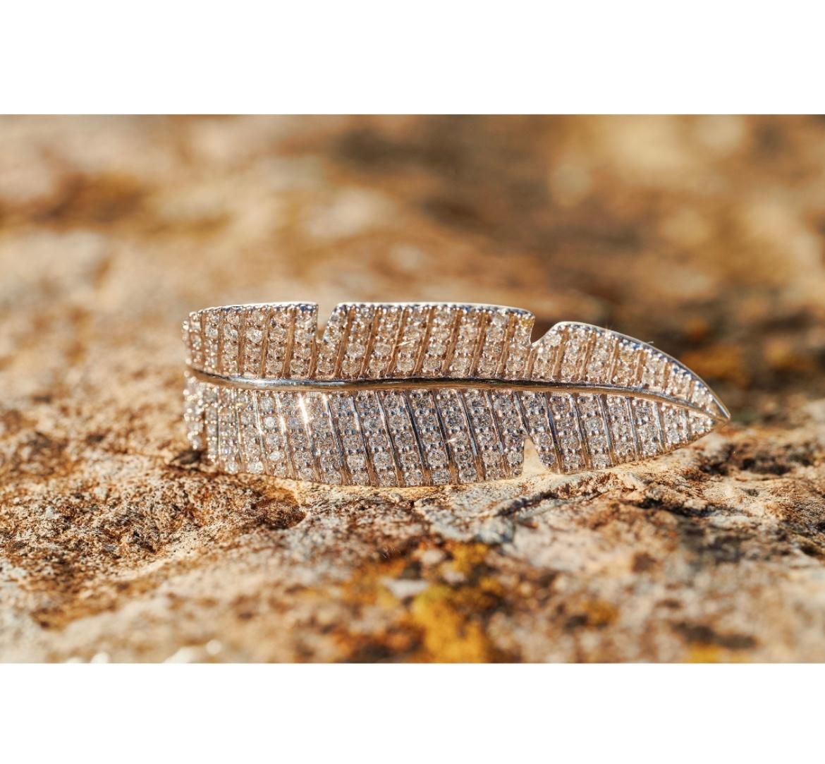 The Paradisica Diamond Ring draws its inspiration from the lush curves of tropical plant life, translating the elegant shape of a banana leaf into sculptural fine jewellery. Crafted in 18K white gold, the ring wraps smoothly around the finger, its