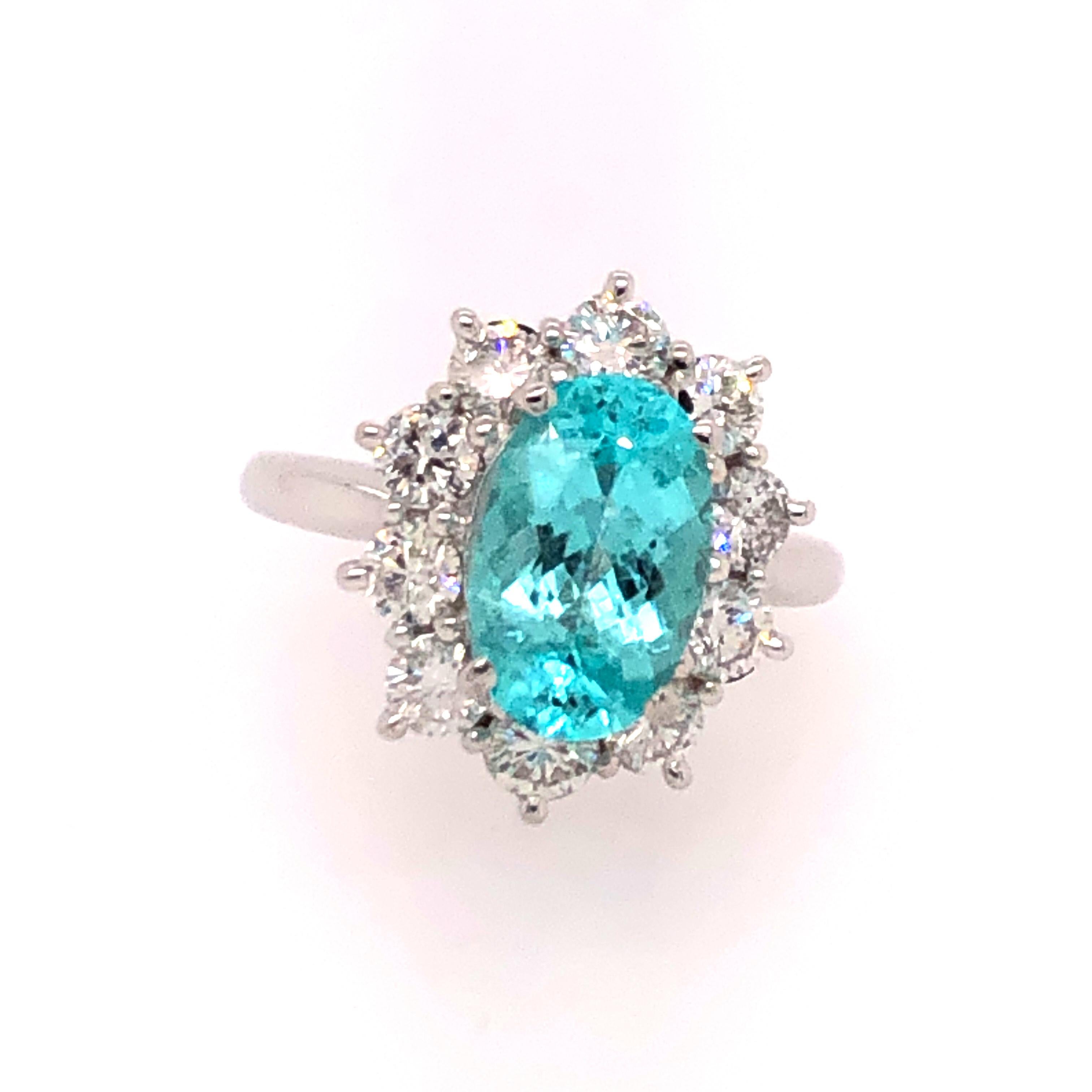 There are rings and then there are rings. . . that you don't want to take off!
Extremely rare and highly sought after, Paraiba tourmaline is for the most serious collector. This exceptionally bright and beautiful 3.07 CT oval Paraiba is set in a