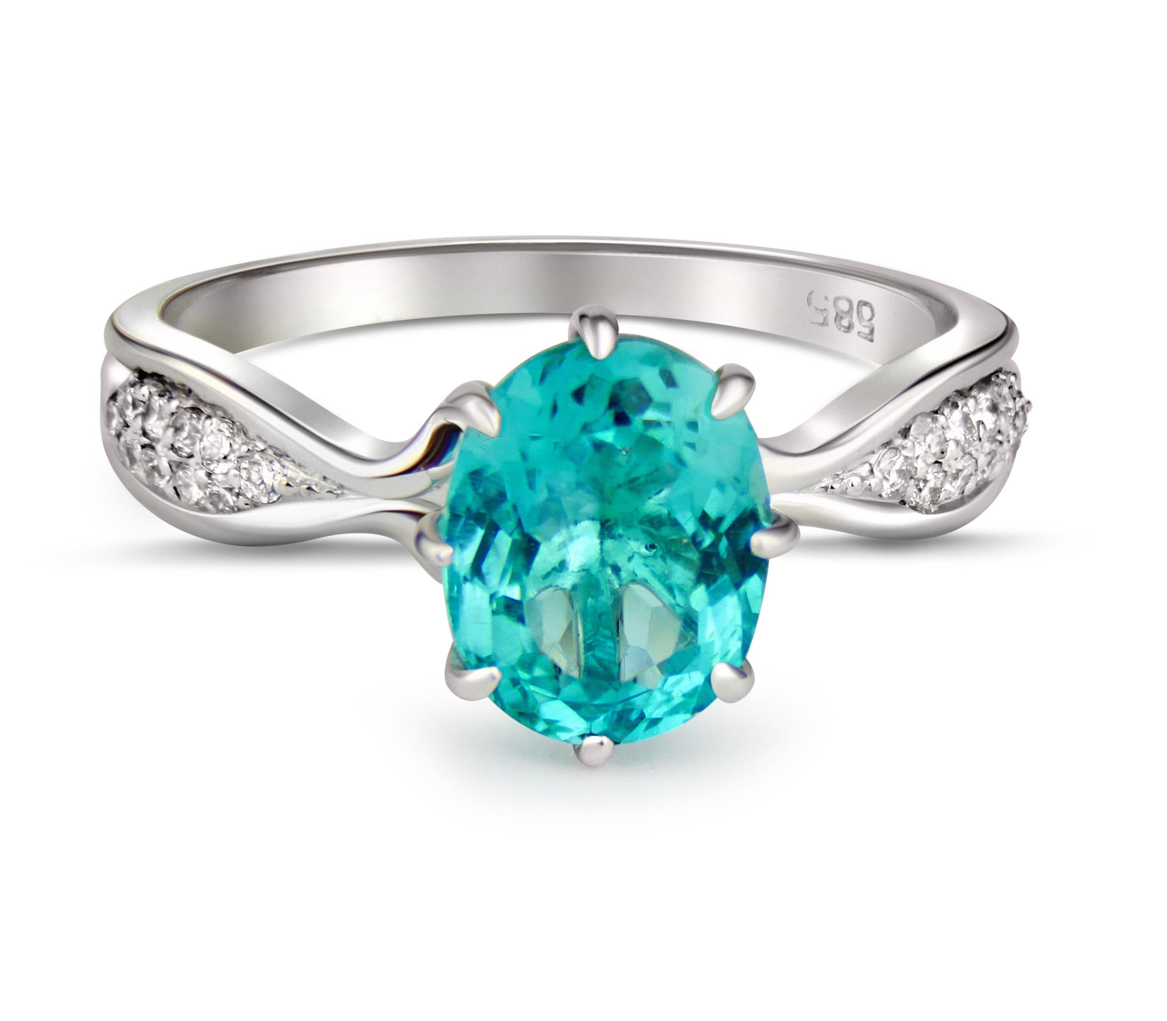 Paraiba blue apatite 14k gold ring. 
Oval Apatite Engagement Ring with Diamonds on sides. Natural Blue Apatite Ring.
 
Metal: 14k solid gold
Weight: 2.1 g (depends from size).

Main stone - apatite, paraiba blue-green color, pear cut, 1 ct weight,