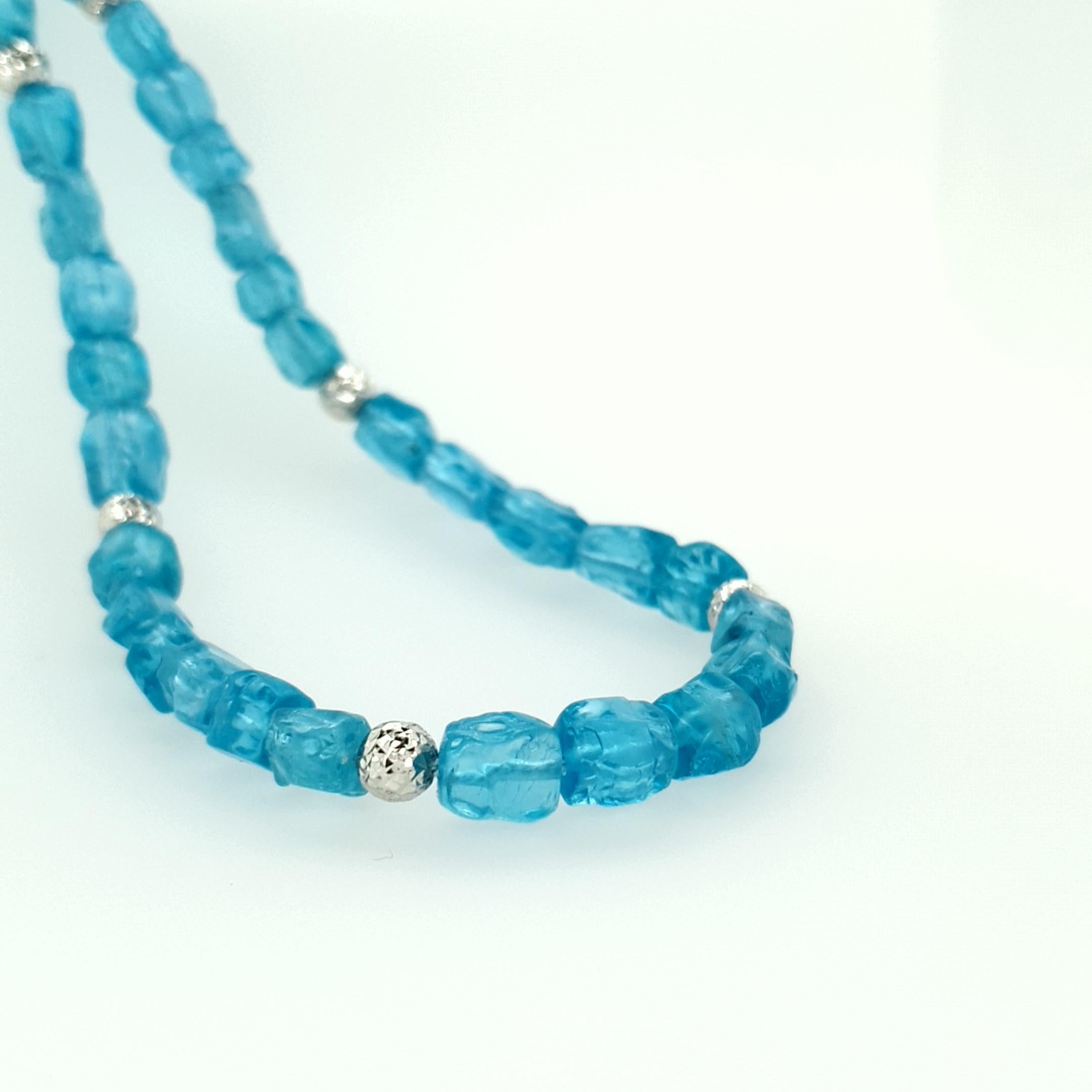 This Natural Paraiba Blue Apatite Nugget Beaded Necklace with 18 Carat White Gold is totally handmade in German quality. The screw clasp is easy to handle and very secure.
Modern and contemperary design combined with a fanatstic colour of Apatite