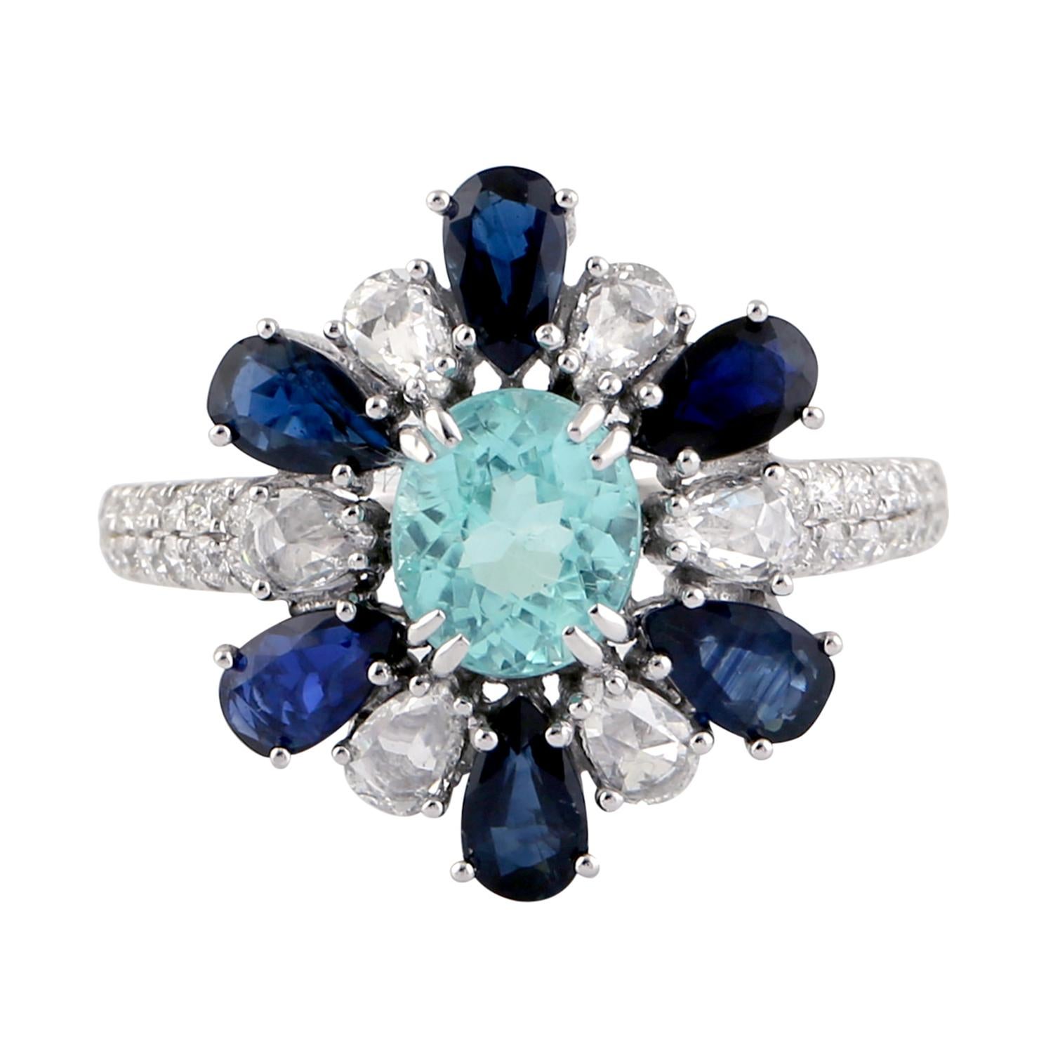 Beautiful Paraiba, Blue Sapphire and Diamond Ring set in 18K White Gold is a really unique. 

Ring Size: 6.5

Gold 18K: 3.56gms
Paraiba: 1.42cts
Blue Sapphire: 1.78cts
Diamond: .71cts