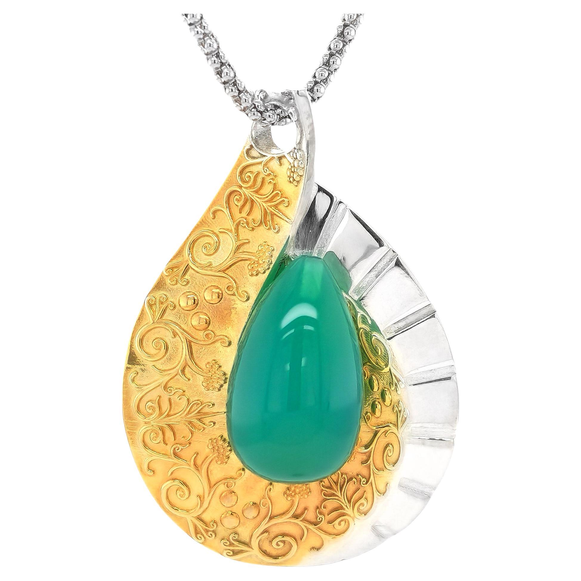 "Paraiba" color Agate 15.27 carats set in Silver and 14K Gold Plated Pendant For Sale