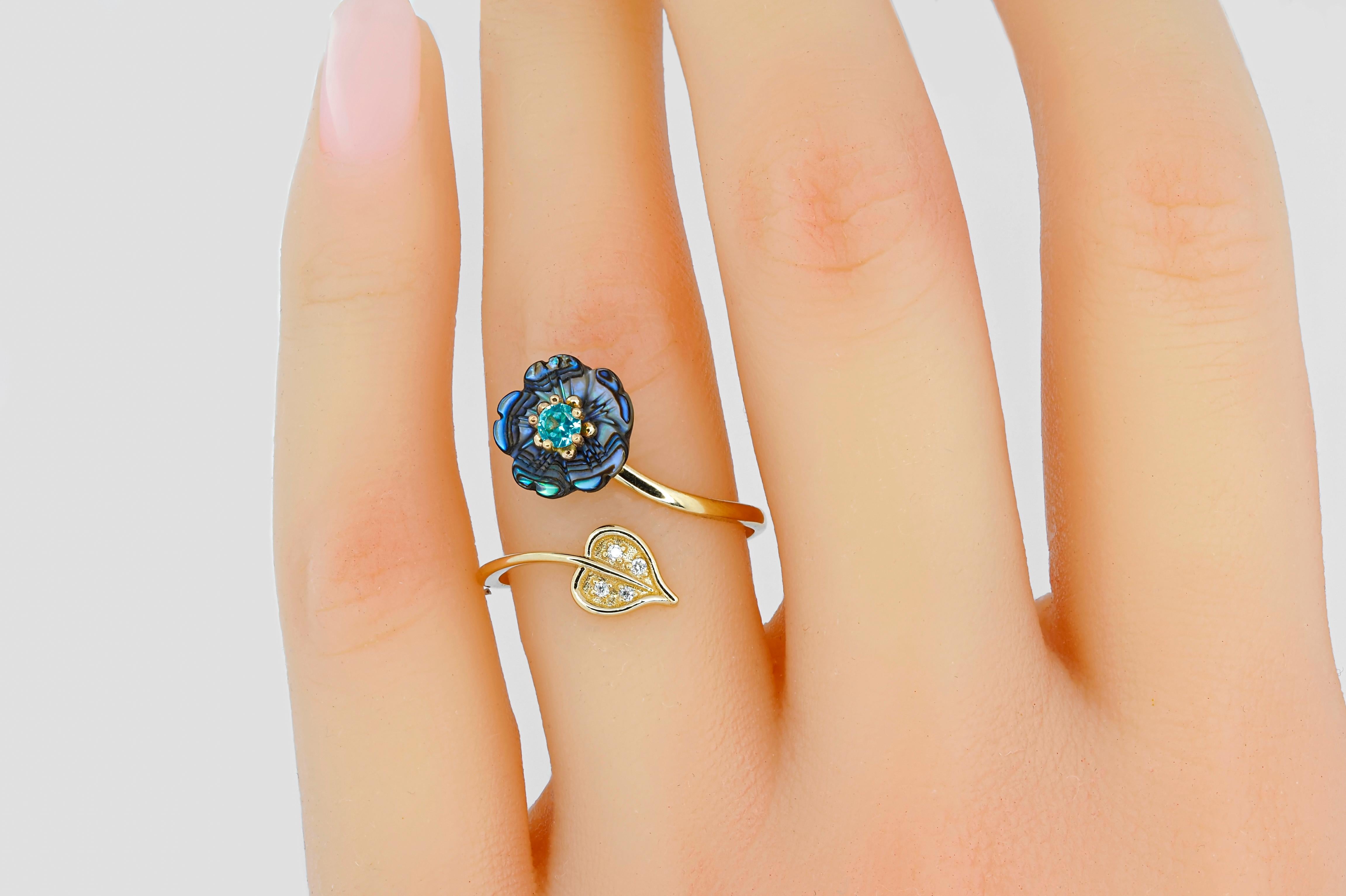 Paraiba gold ring. Round paraiba ring. Blue gemstone ring. Open ended ring. Carved mother of pearl flower ring. Flower gold ring. Adjustable gold ring. Black flower ring.

Ring has a free size and can be worn with finger size from 17.2 - 18.5