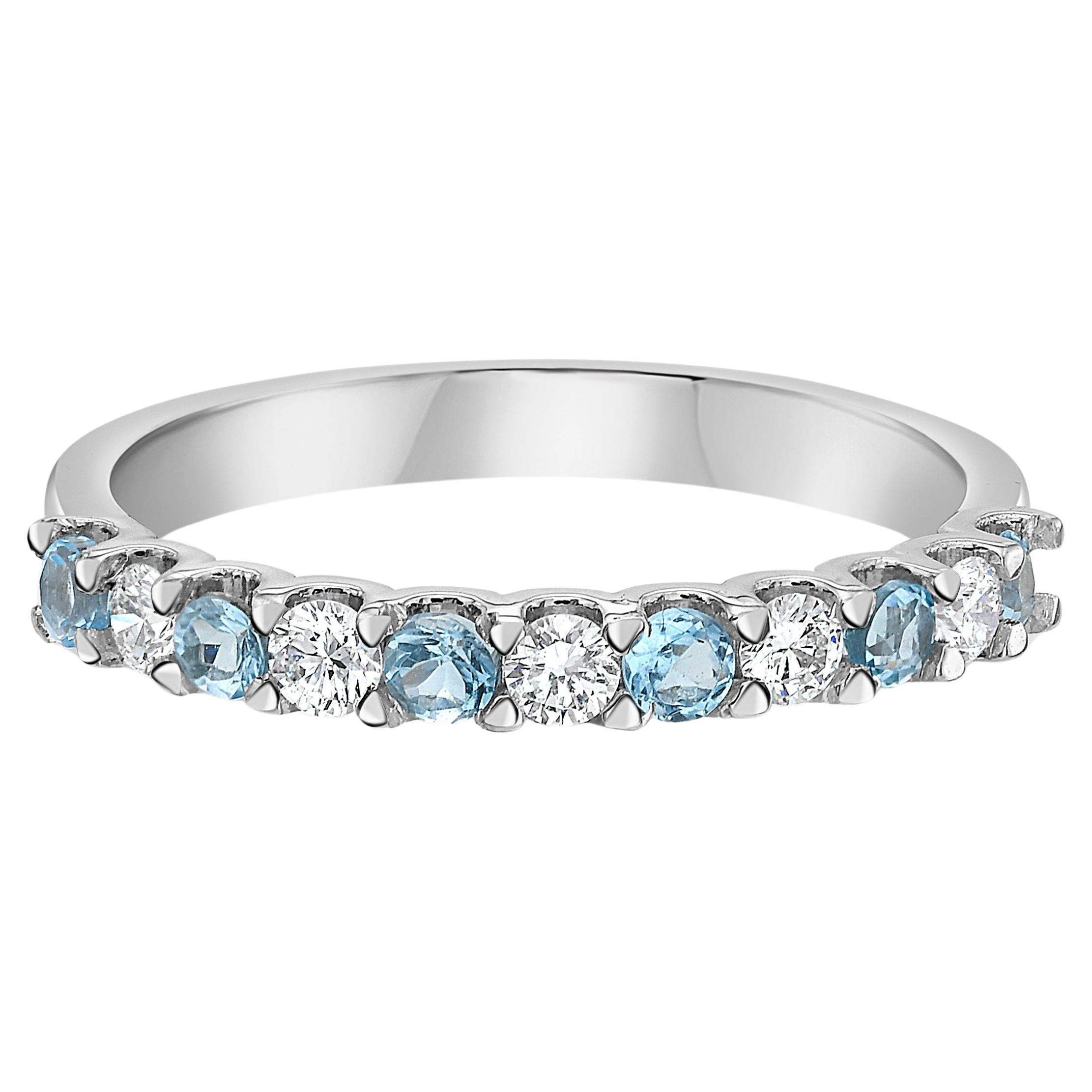 Gönnen Sie sich puren Luxus mit unserem exquisiten Paraíba Turmalin- und Diamantring. In diesem stapelbaren Ring aus 18 Karat Weißgold wechseln sich elektrisch blaue Paraíba-Turmalinsteine mit Diamanten in VS-Qualität ab. Das perfekte Schmuckstück