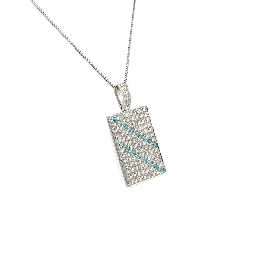 Simply Beautiful! Vintage Paraiba Tourmaline and RBC Diamond Dog Tag Gold Pendant. Measuring approx. 1.1” l x 0.5” w. Securely Hand set with Paraiba Tourmaline, weighing approx. 0.20tcw and Round Brilliant Cut Diamonds, weighing approx. 1.50tcw.