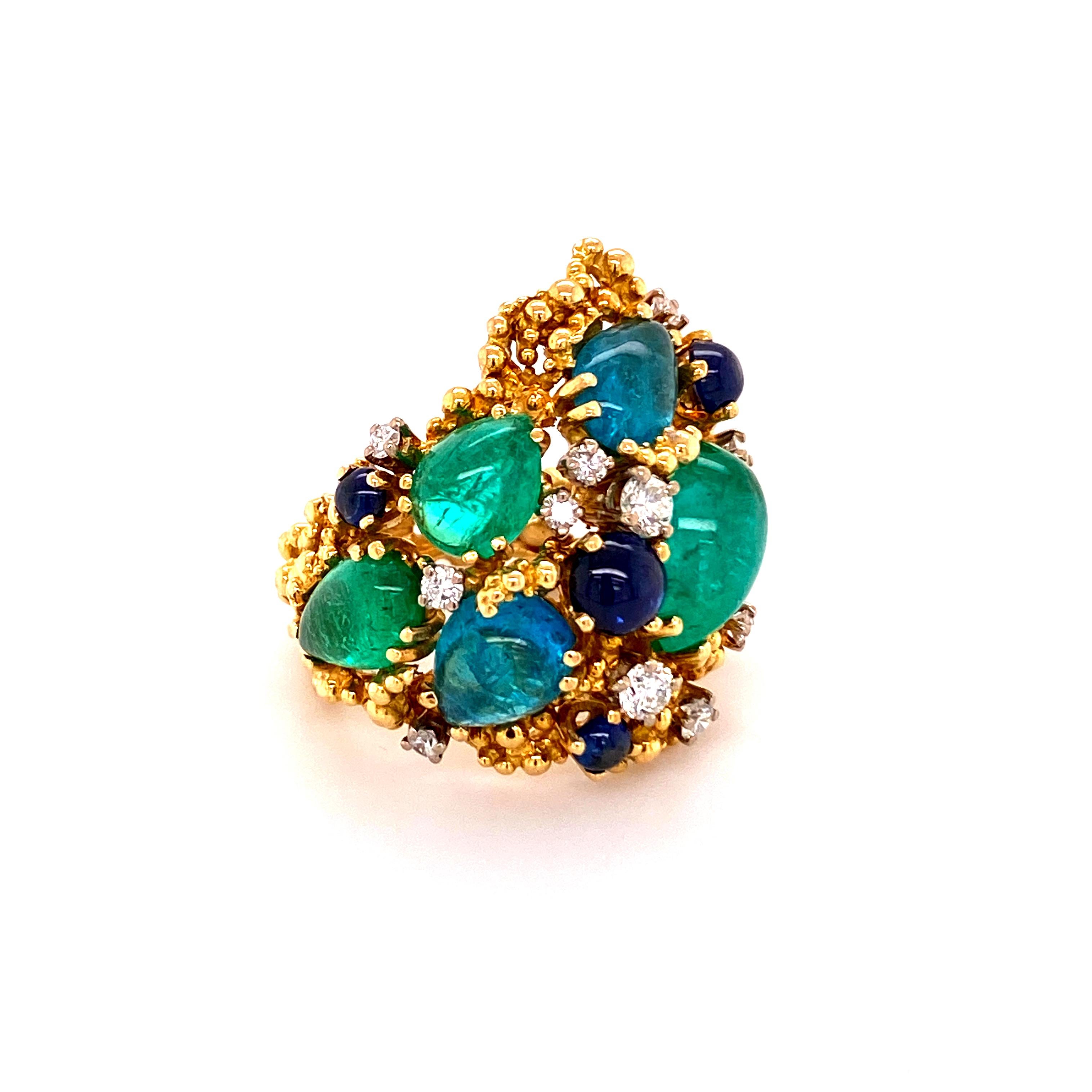 This superb piece of art by Gilbert Albert features five pear shaped paraiba tourmalines of electric neon blue and blue-green color, total weight approximately 7.80 carats. The stones are carefully arranged and set in 18 karat yellow gold. Accented