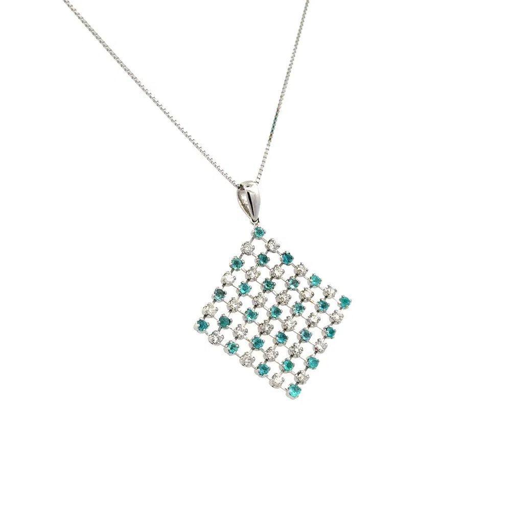 Simply Beautiful! Vintage Paraiba Tourmaline and RBC Diamond Lacy Gold Pendant. Measuring approx. 1.4” x 1.1”. Securely Hand set with Paraiba Tourmaline, weighing approx. 0.56tcw and Round Brilliant Cut Diamonds, weighing approx. 0.50tcw. Hand