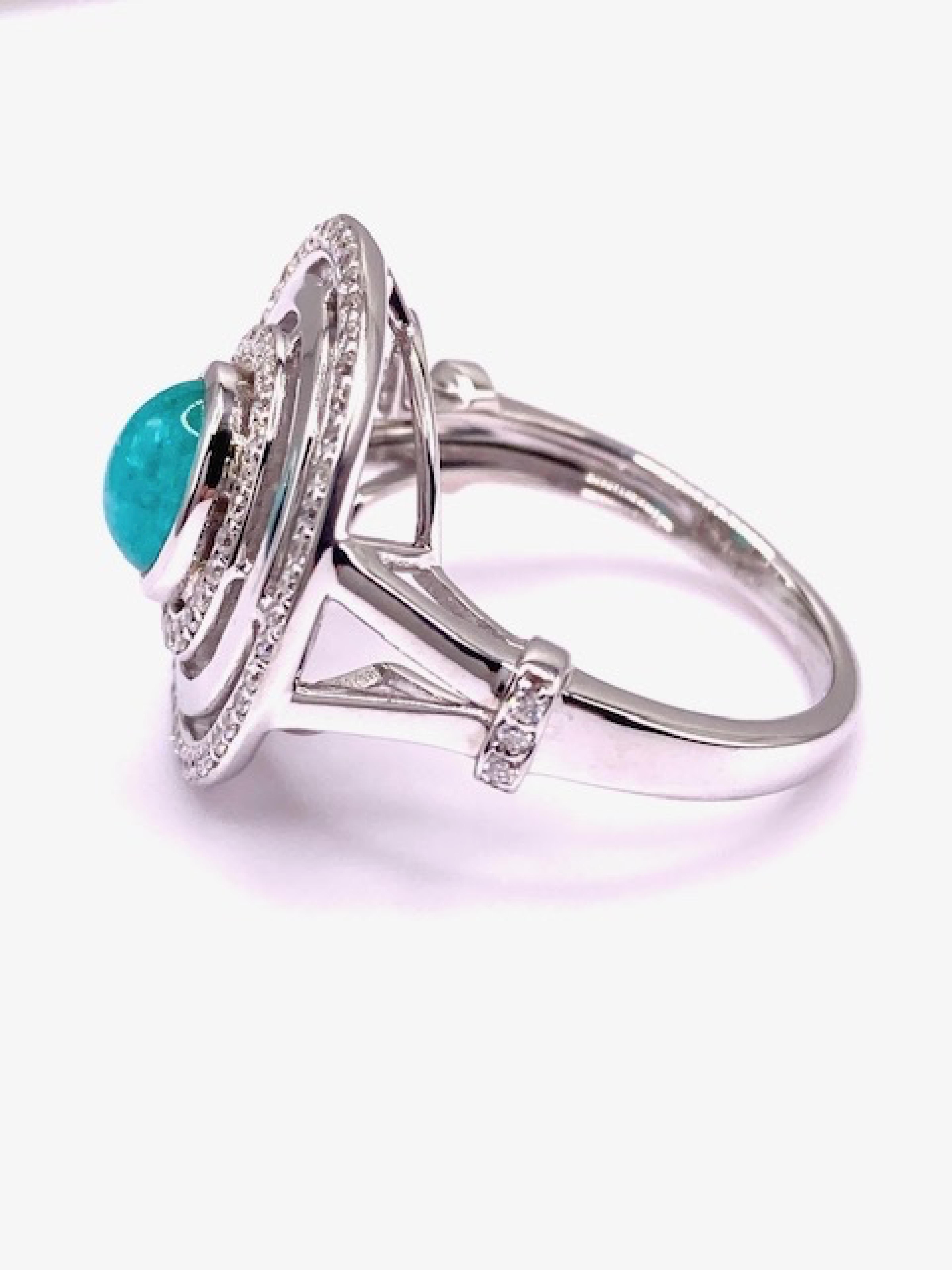 Inspired by Saturn, this one Carat Brazilian Paraiba Tourmaline is neon blue and set in 14 Karat white gold. 