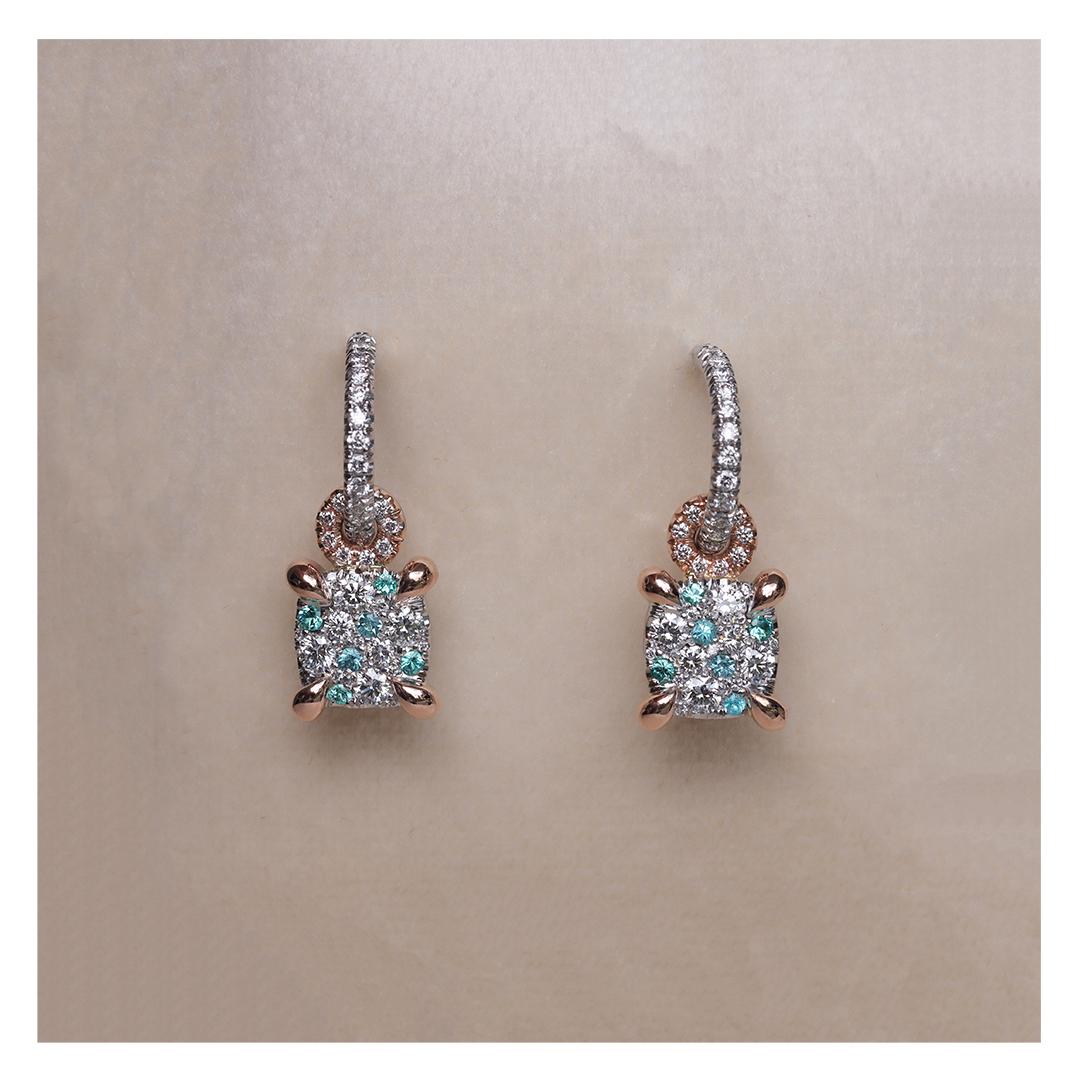 Handcrafted with unparalleled precision in Belgium by designer Joke Quick, these exquisite charm earrings feature an elegant cushion shape, pave set with Paraiba Tourmalines from Brazil and sparkling diamonds. 

These earrings feature a detachable