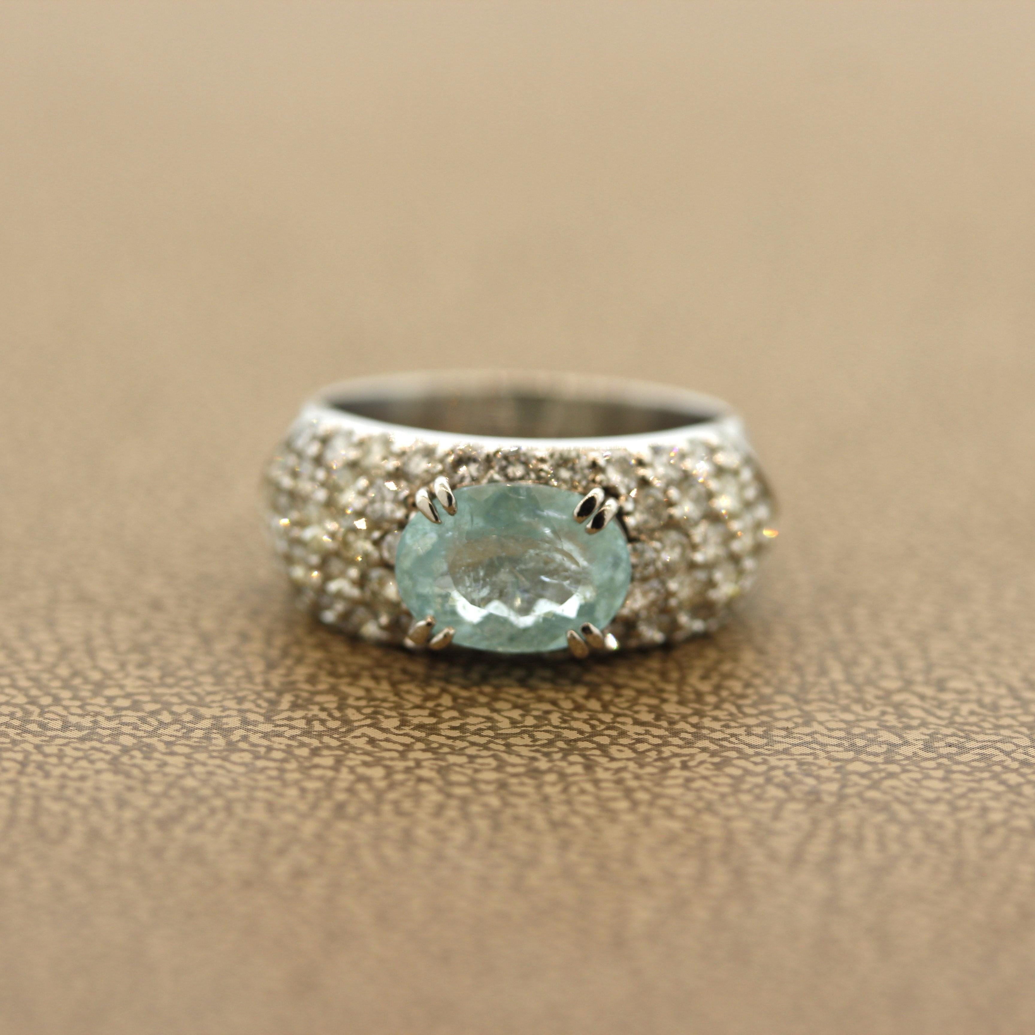 A sweet platinum ring featuring an electric blue Paraiba tourmaline! It weighs 2.24 carats and has the sought after electric soft blue color making this gem variety unique and rare. It is complemented by 1.58 carats of round brilliant-cut diamonds