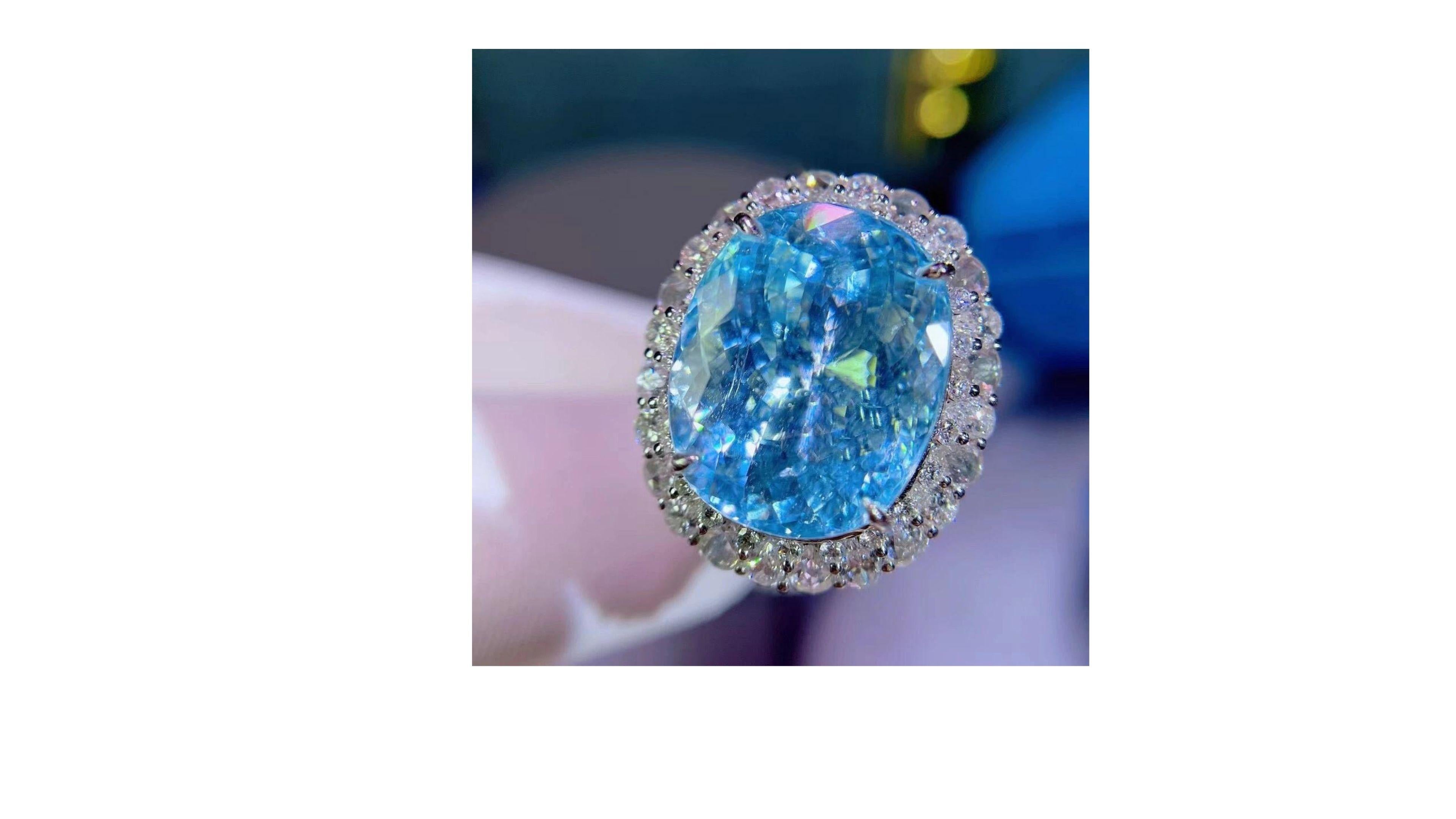 
This is a very unique 17.95 Carat  Paraiba Tourmaline Ring with 123 diamond around it.  You can also change it to a  necklace too as it detaches from the ring mount easily.  Its very rare to jut find one with this many many carats too. We have