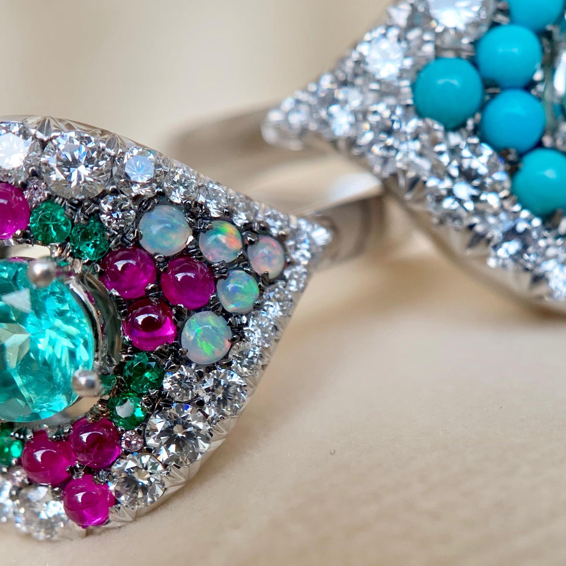 One of a kind ring handmade in Belgium from jewellery designer Joke Quick, in 18K White gold 9,1 g. Set with a Paraiba Tourmaline centerstone 0,39 Carat., pink Sapphire cabochons, Australian white opal, emerald 0,06 ct., White brilliant-cut diamonds