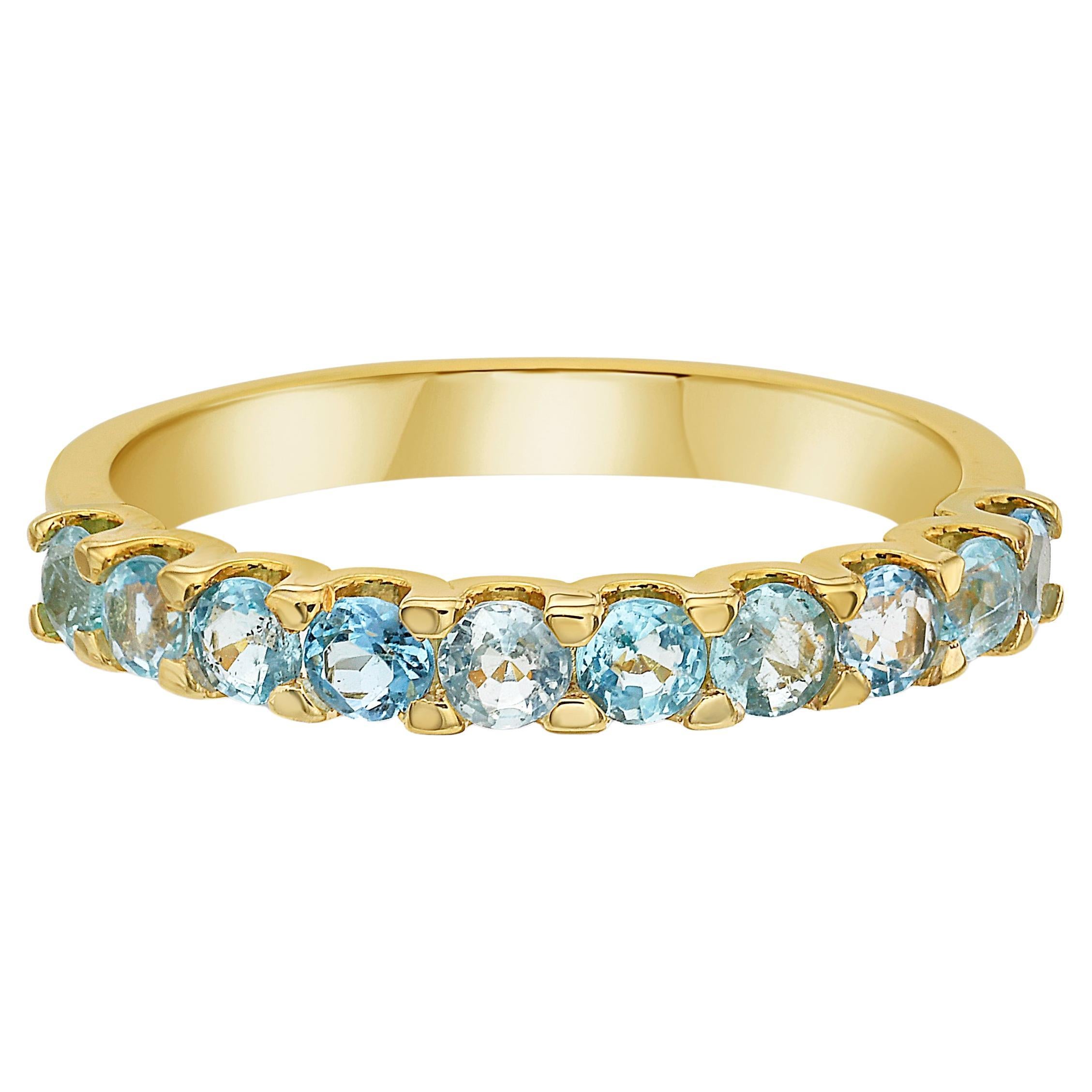 Indulge in pure luxury with our exquisite Paraíba Tourmaline Ring. Crafted with 18k yellow gold, this stackable ring features electric blue Paraíba tourmaline stones. The perfect statement piece for those who desire something unique and