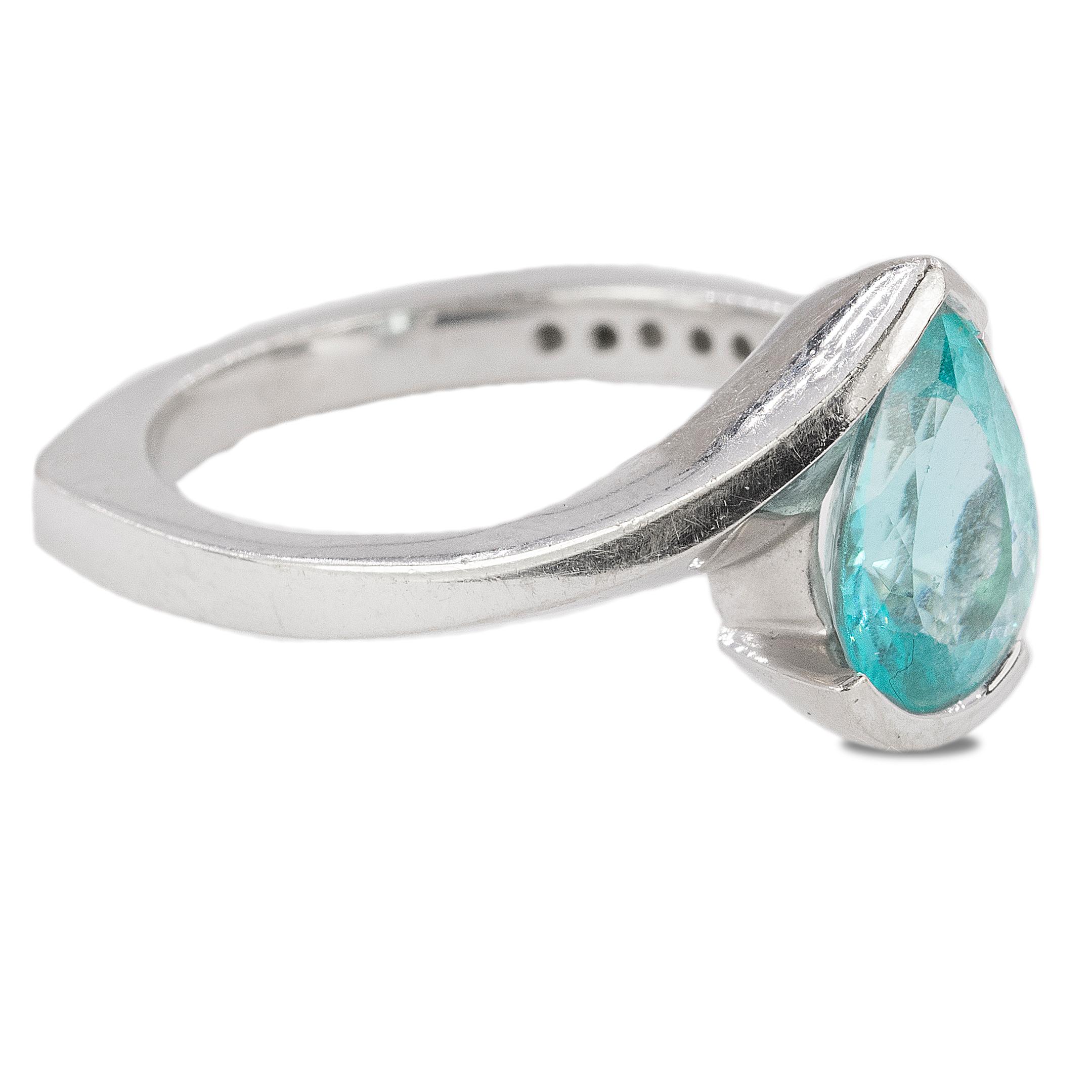 18k hand fabricated white gold ring with Gubelin certified 2.42 carat pear shape Paraiba Tourmaline measuring 11.82 s 7.99 x 4.91mm and approximately 0.40 carats of round brilliant diamonds.  