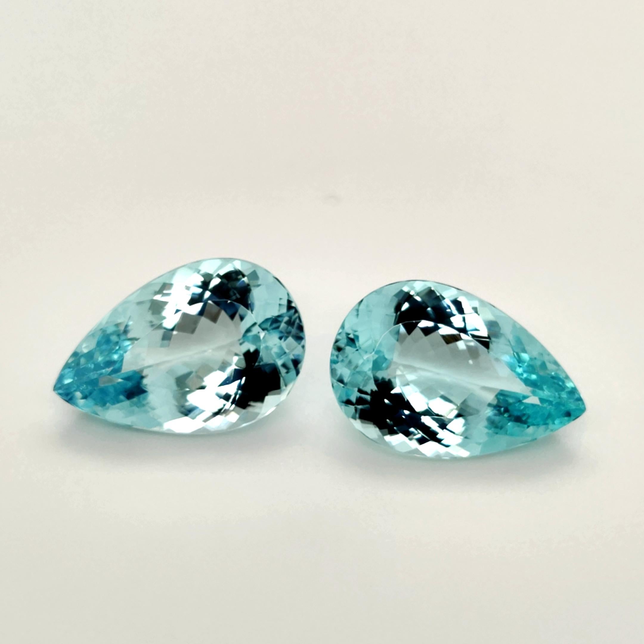 Contemporary Paraiba Tourmaline Set 24.01 Carat & 24.45 Carat Pear Flawless Loose Gemstones For Sale