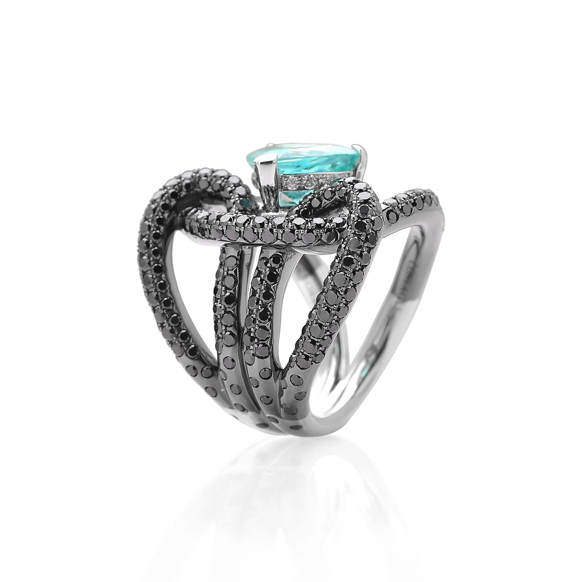 From the 'Intrecci' Collection, one-of-a-kind trillion shape paraiba-type ring set in 18 karat white gold with black rhodium finish and pave-set black diamond detailing. 

The beauty is in the details - from the combination of beauty is in the