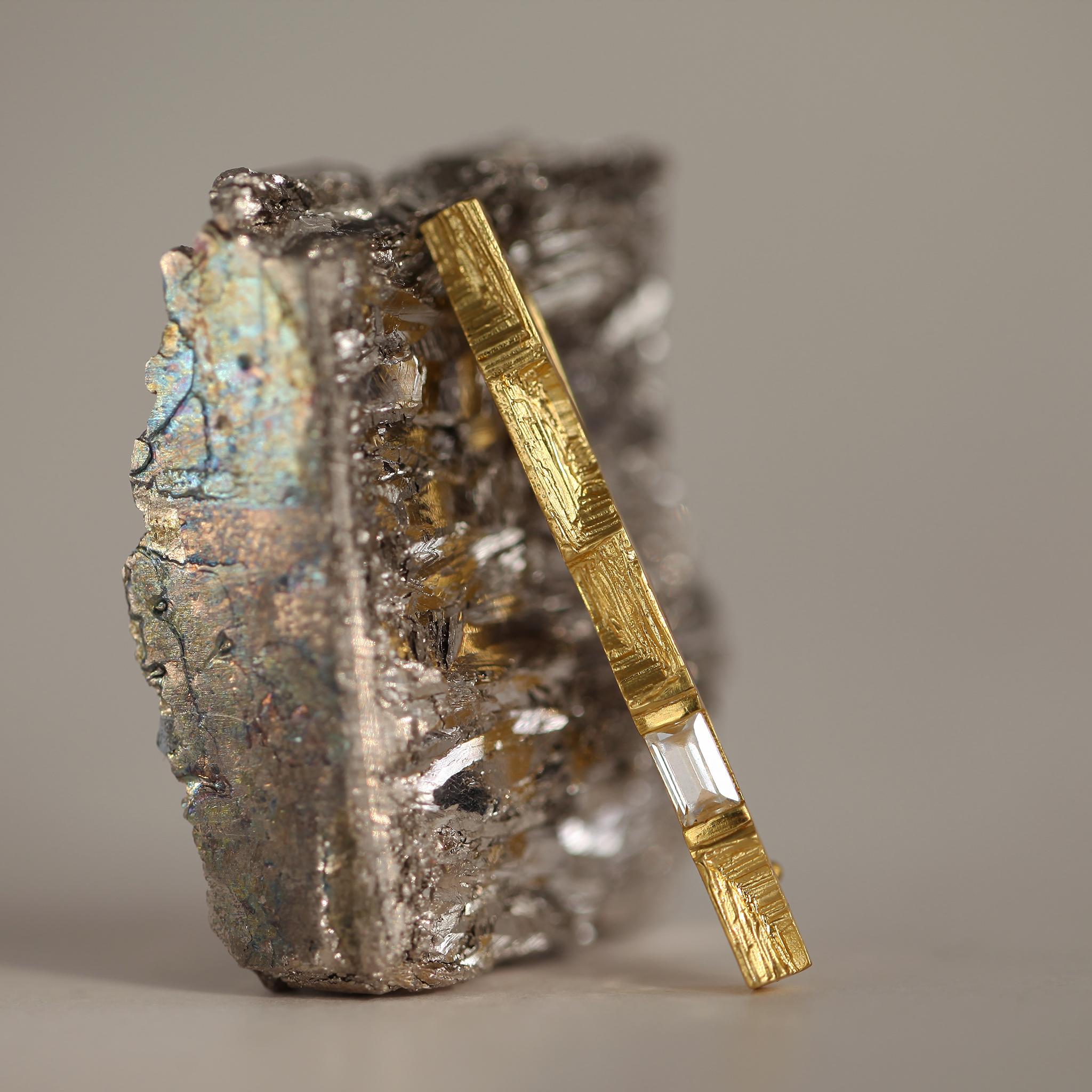 0.3 Carat Baguette Cut Diamond 18k Gold Architectural Modernist Statement Brooch.

Unfolding an interplay of light and form, the Parallax Brooch in 18k gold blends optical dynamics with rich, tactile texture. Driven by a fascination with visual