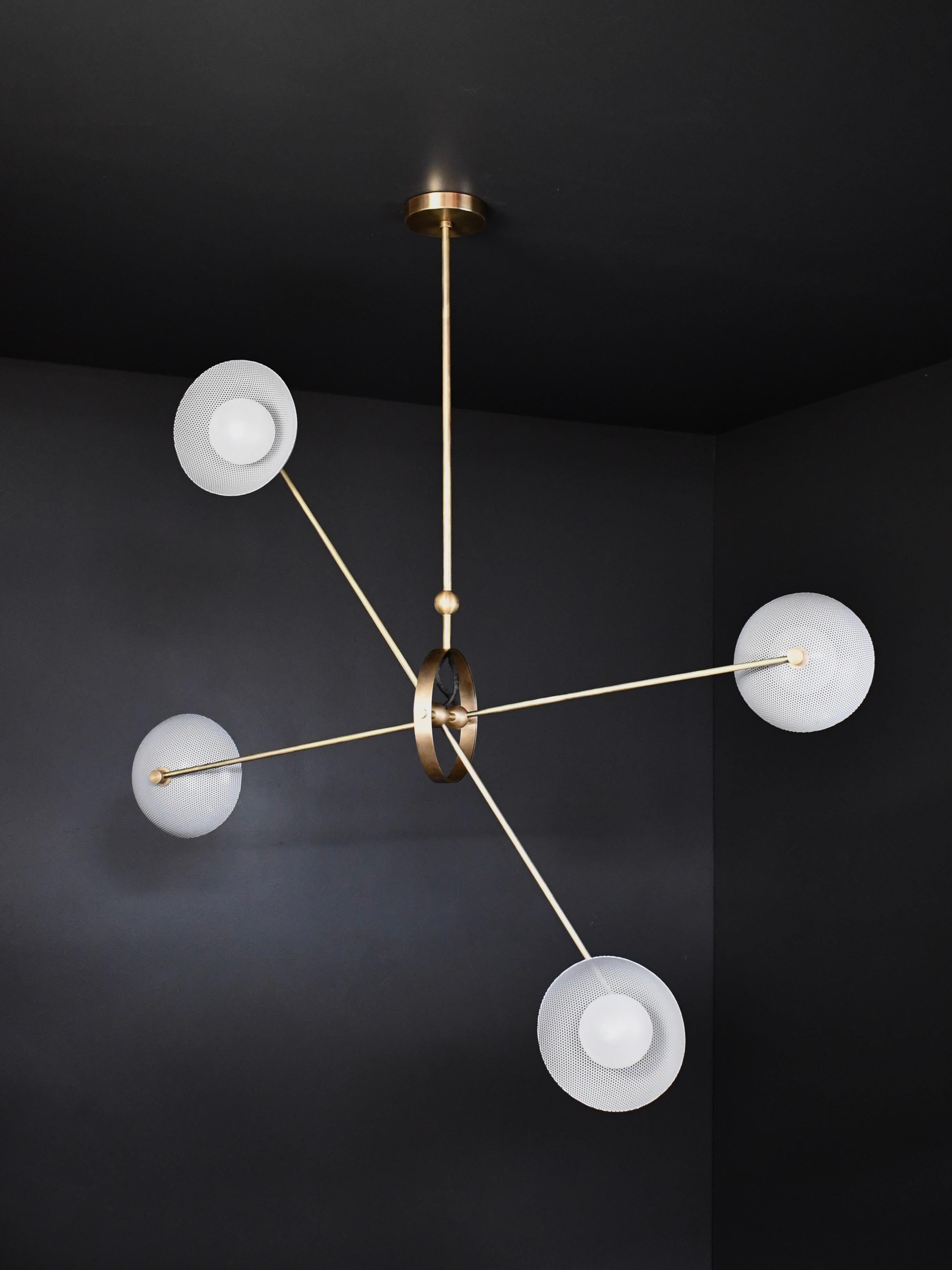 The Parallax ceiling fixture conveys a strong modern design defined by balance and equilibrium, a functional sculpture suspended in space. Parallax features four bowl-shaped shades fabricated of spun metal mesh ensconcing blown opal glass orbs.
