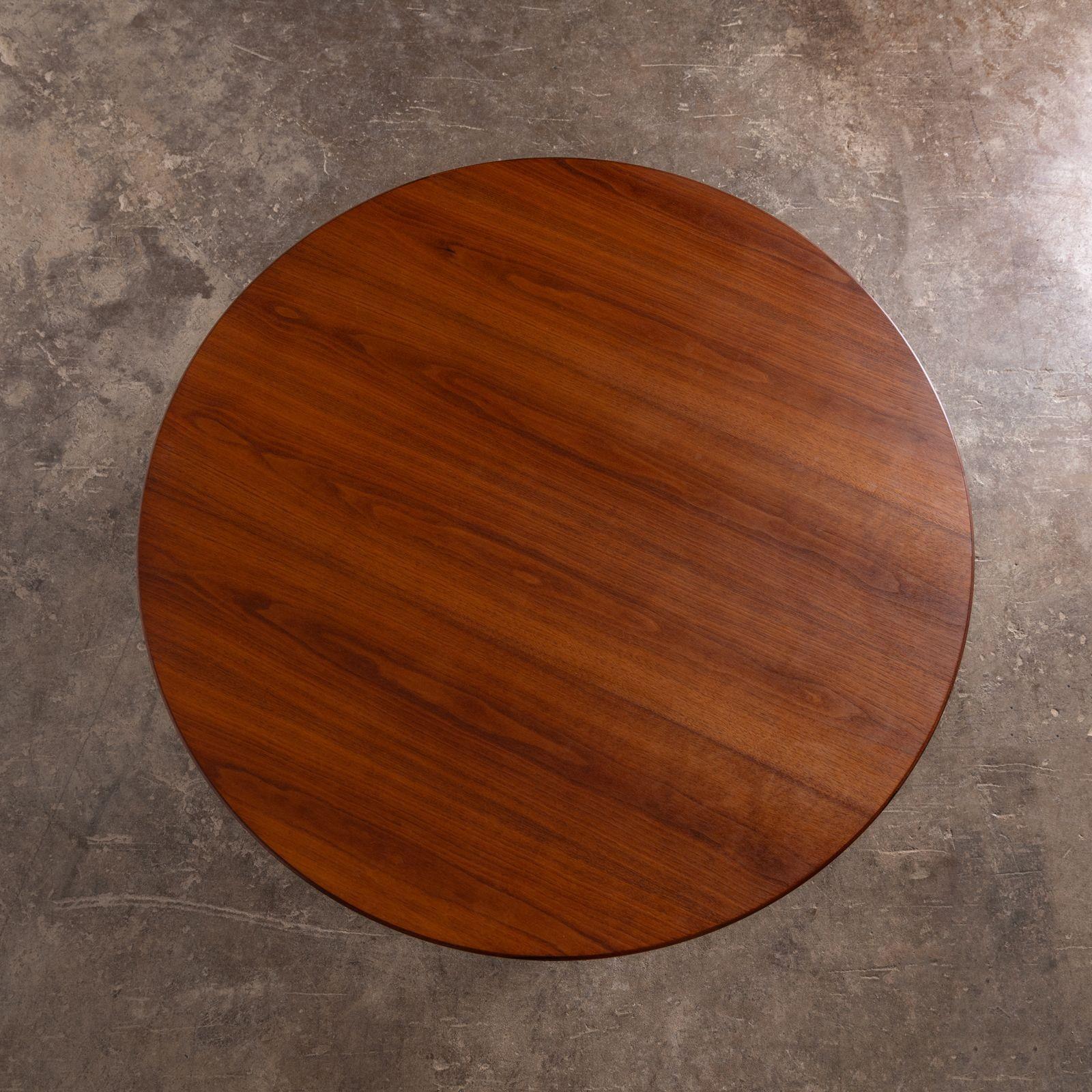 Aquired from the estate of a retired architect. Early production parallel bar cocktail table by Florence Knoll, 1951 for Knoll Asscoiates. The table is constructed with a walnut top with satin steel legs and is in beautiful original condition.