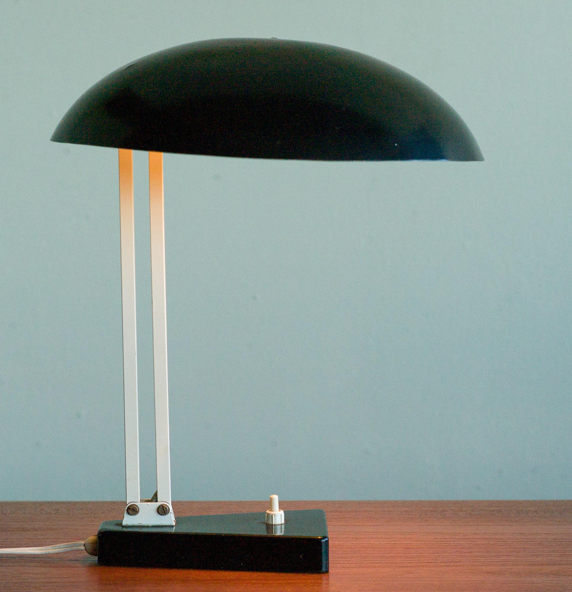Dutch designer H. Th. Busquet designed this adjustable desk lamp for HALA Zeist, the Netherlands.
 