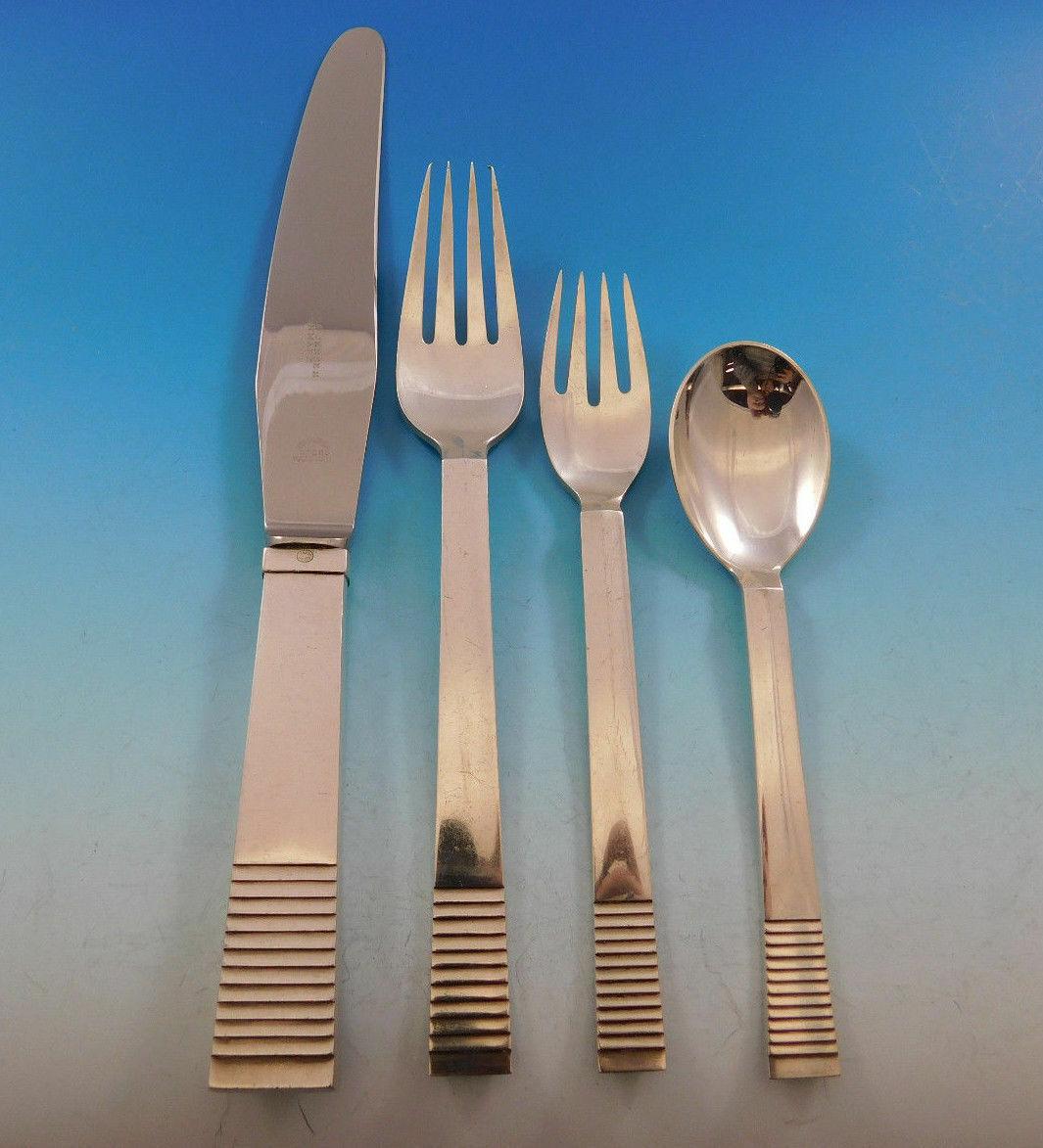 The parallel pattern was designed by O. Gundlach-Pedersen in 1931. Georg Jensen flatware is world renowned for its high quality, beauty, and elegance.

Outstanding dinner size parallel by Georg Jensen sterling silver flatware set, 88 pieces. This
