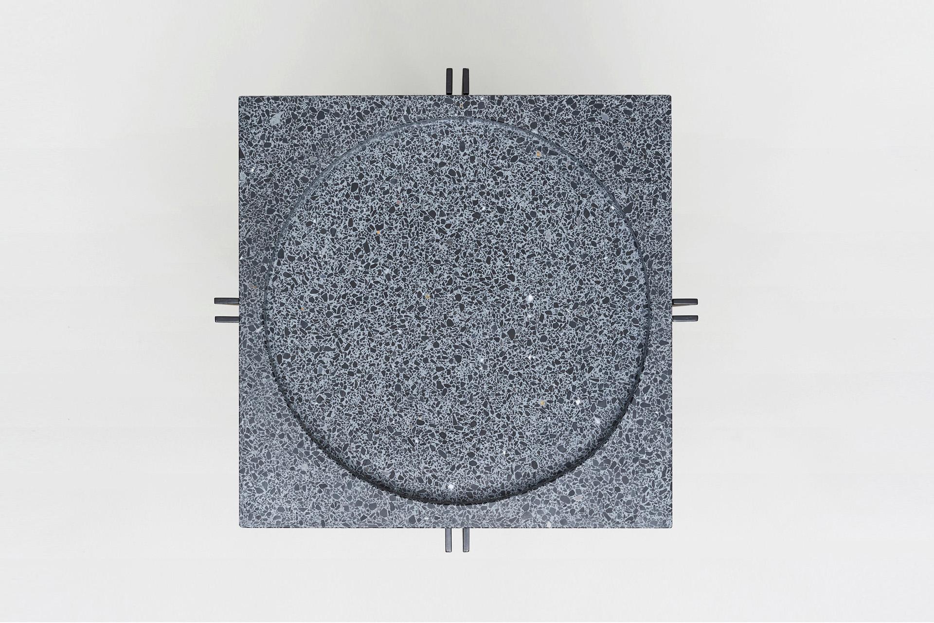 The form of our parallel bowl is extruded in this piece to create the parallel side table.

A terrazzo slab, with a circular recess for the top, nestles into a steel base.

Dimensions: 440 L x 440 W x 550 H

Materials: 2pac black steel base with