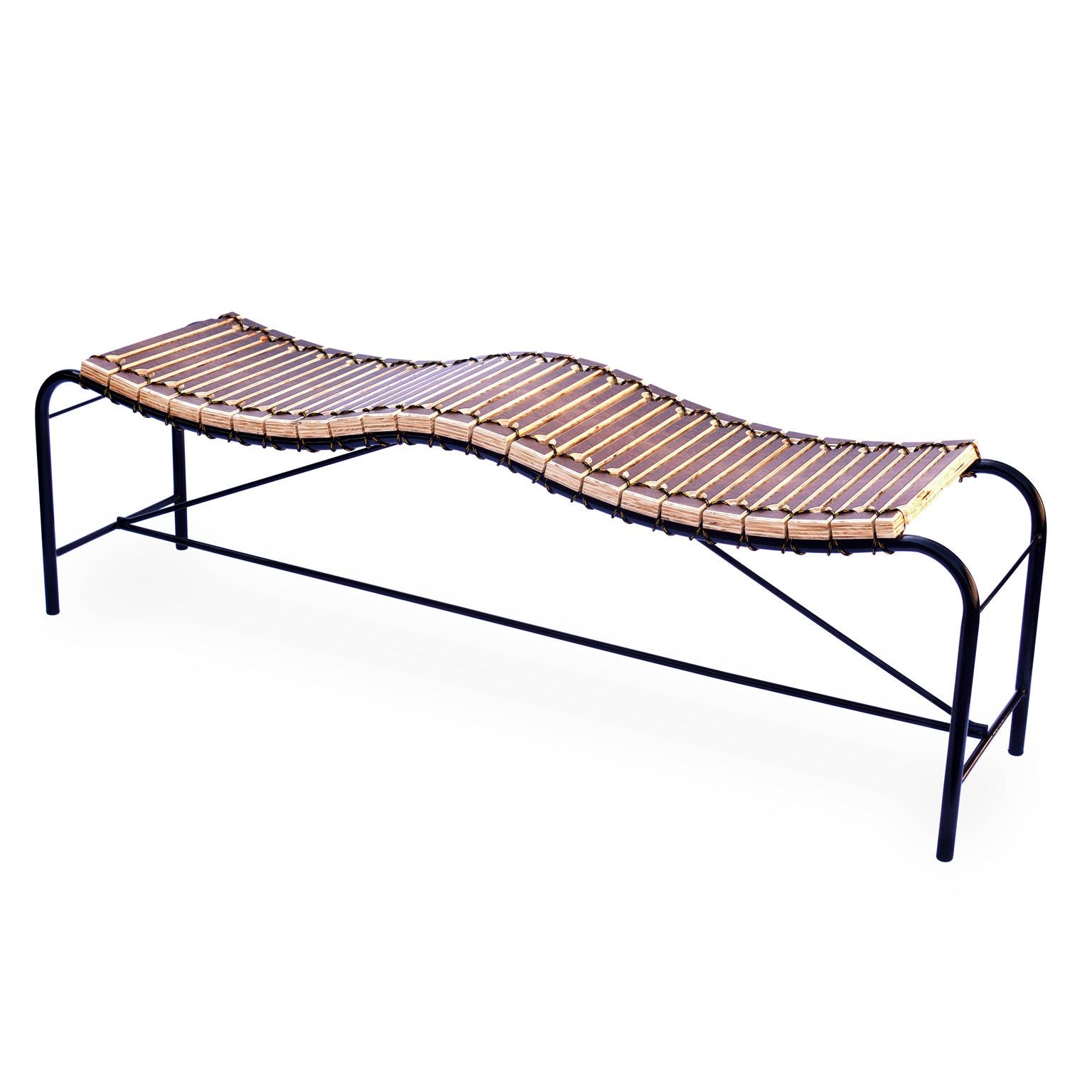 This contemporary styled bench is part of the Ruptura collection, inspired by woodworking techniques, where a series of parametric cuts are made in a single piece of wood, with this process it is possible to obtain a malleability in this wood and at