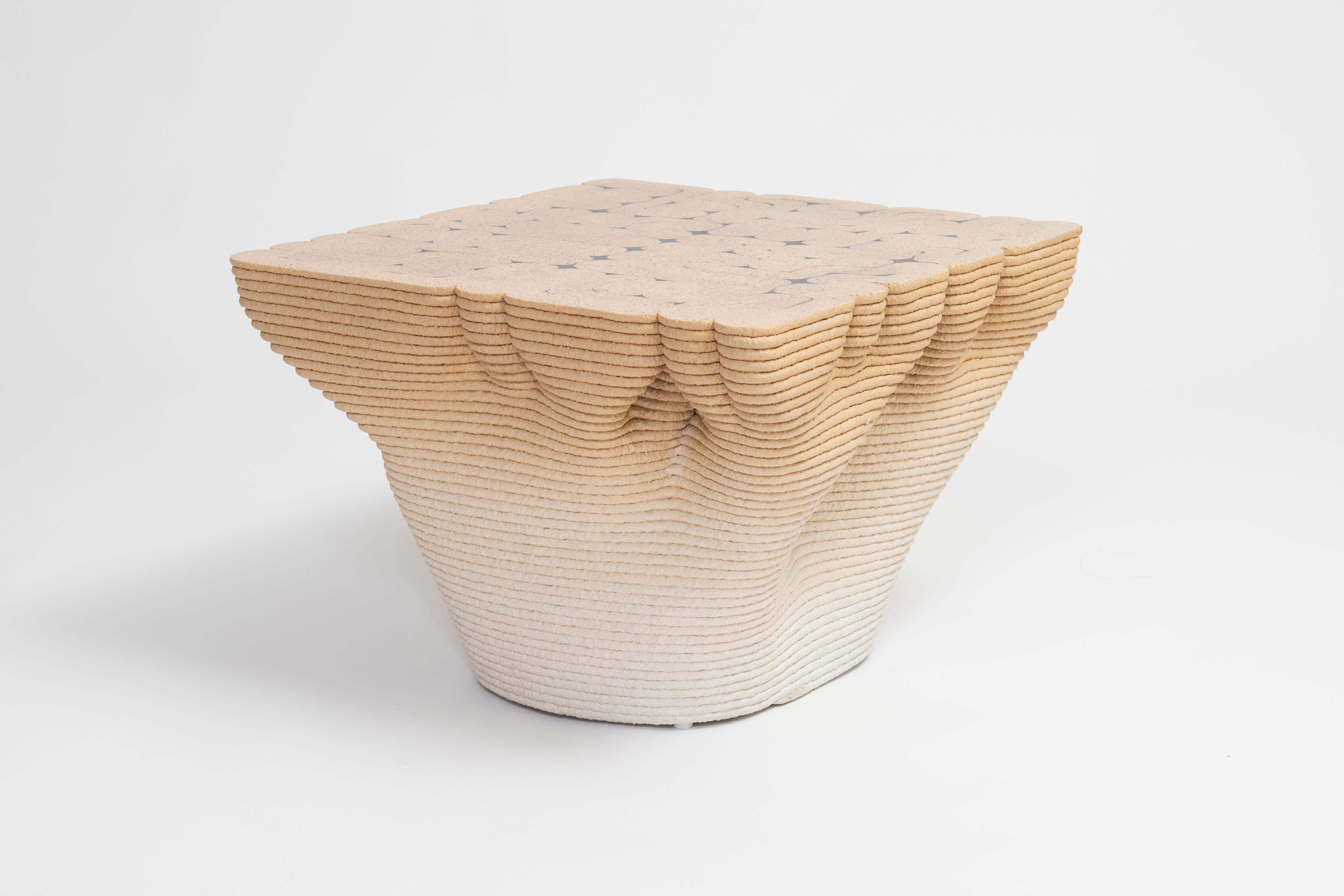 The Paramorph Table by Philipp Aduatz, created and designed in collaboration with Austrian manufacturer incremental3d, explores the possibilities of parametric design in combination with innovative 3D concrete printing technology.
The sculptural