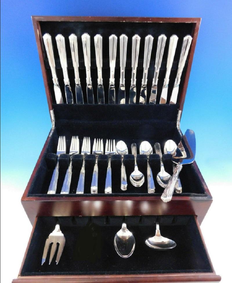 Fabulous paramount by Kirk sterling silver flatware set, 64 pieces. This modern design is based on the city skyline and architecture (see copy of original advertisement for this pattern 