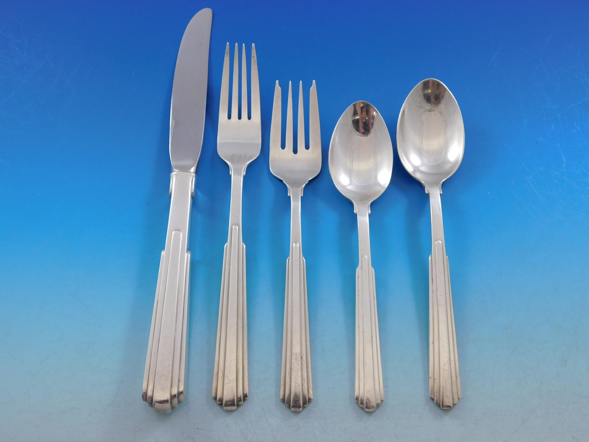 Paramount by Kirk sterling silver flatware set, 69 pieces. This modern design is based on the New York city skyline and architecture. This set includes:

12 knives, 9 1/8