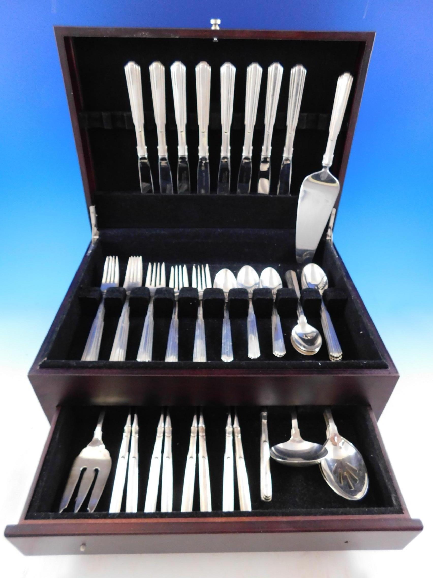 Paramount by Kirk sterling silver flatware set, 55 pieces. This modern design is based on the New York city skyline and architecture. This set includes:

8 knives, 9 1/8