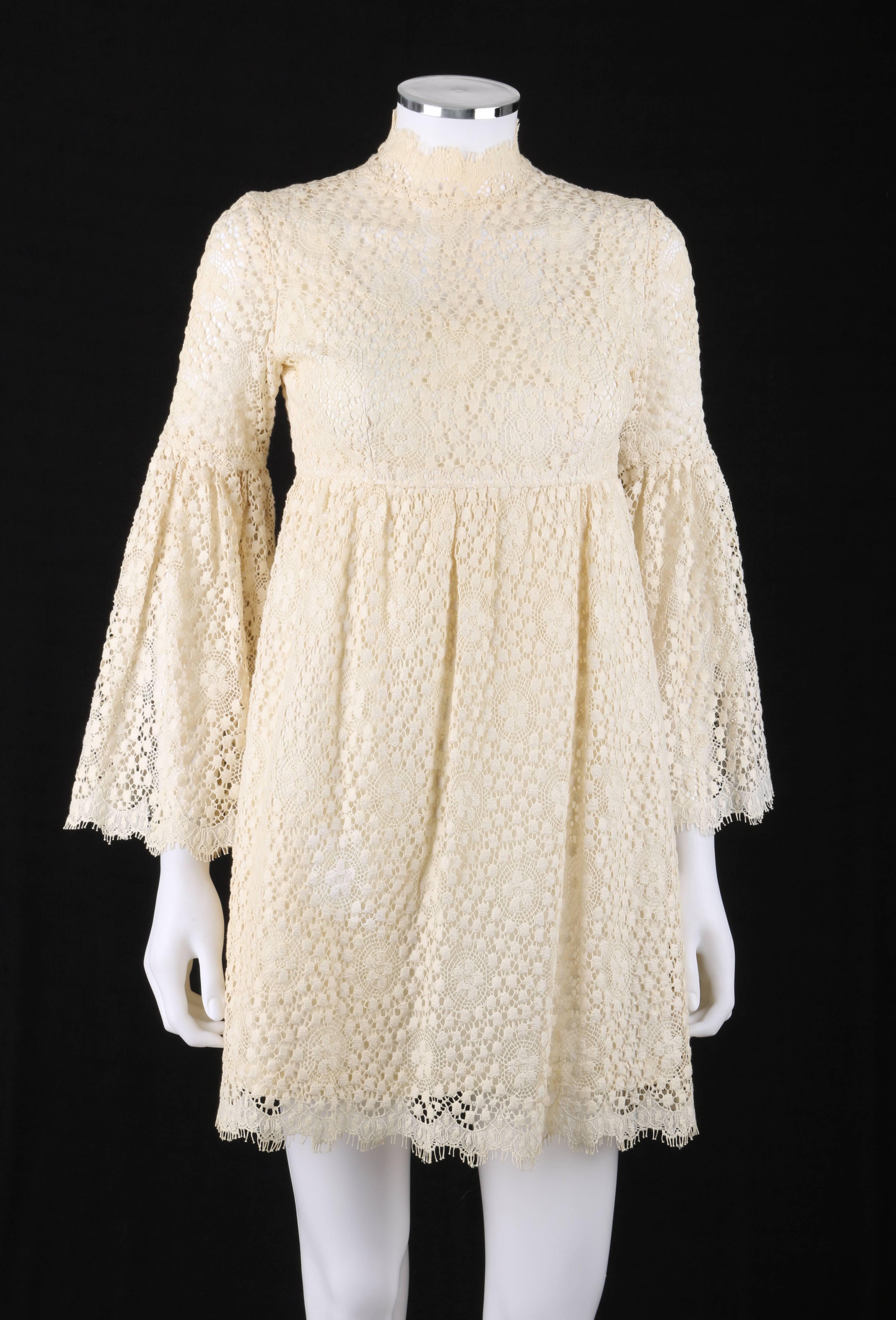 Vintage Parc Jrs. Petite c.1960's cream floral crochet lace flounce sleeve babydoll dress. The epitome of bohemian / flower child dress. Mandarin collar. Empire waist. Long sleeves with flounce at elbow. Gathered waistline skirt. Scallop edge with