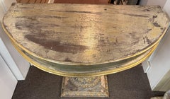 Parcel Gilt and Polychrome Demilune Console Table with Urn Form Pedestal Base