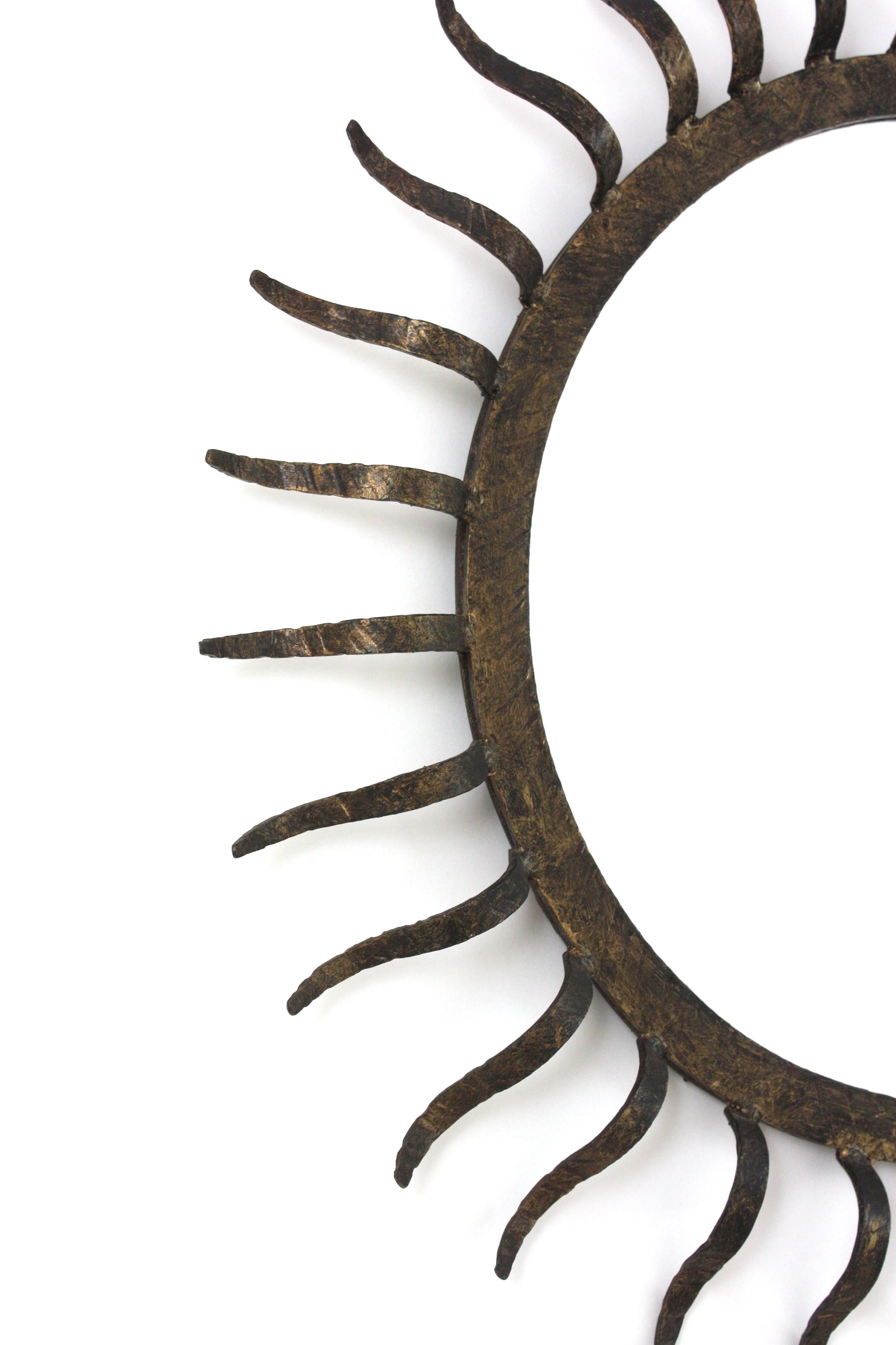 French Parcel Gilt Sunburst Mirror in the Style of Gilbert Poillerat For Sale