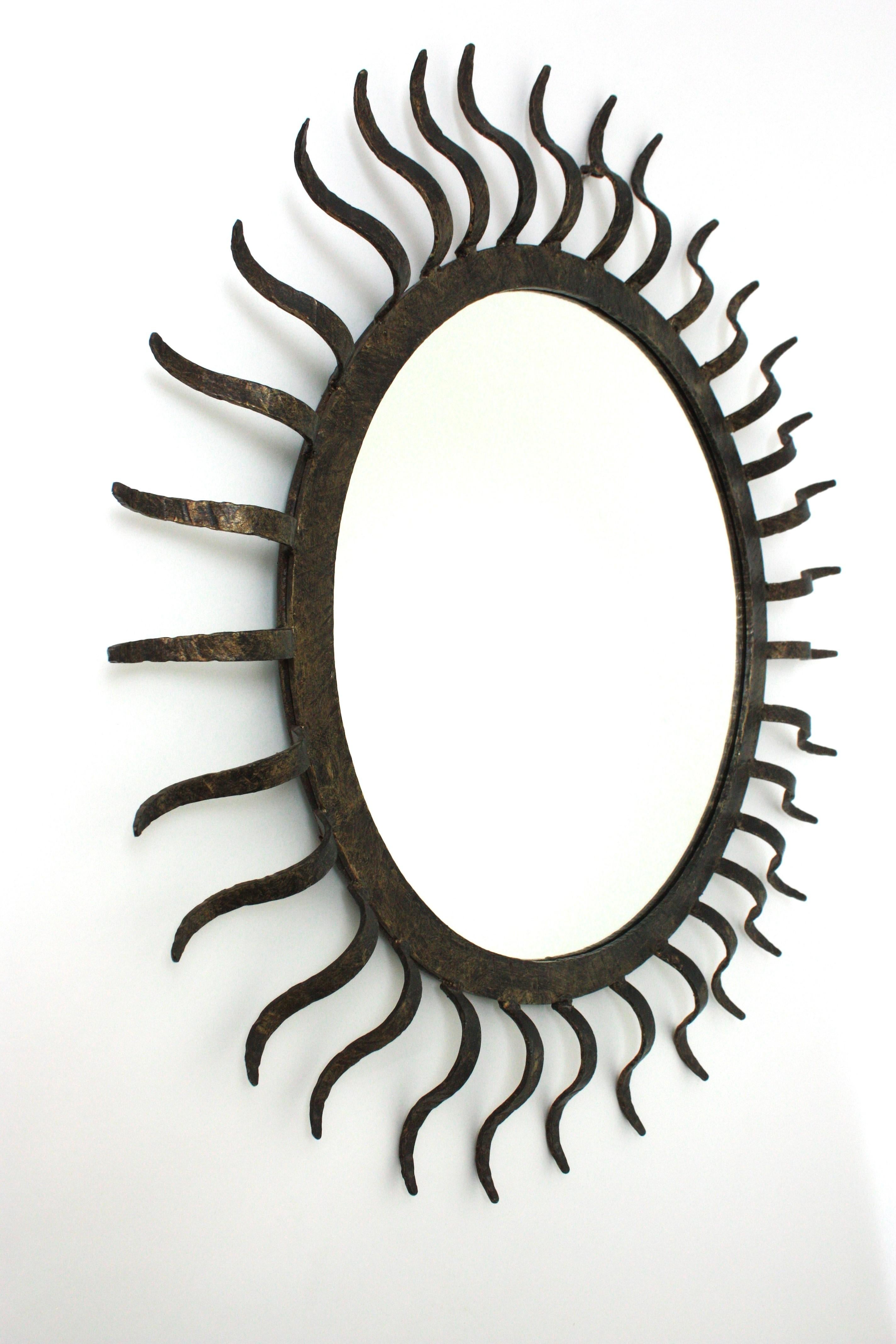 Forged Parcel Gilt Sunburst Mirror in the Style of Gilbert Poillerat For Sale
