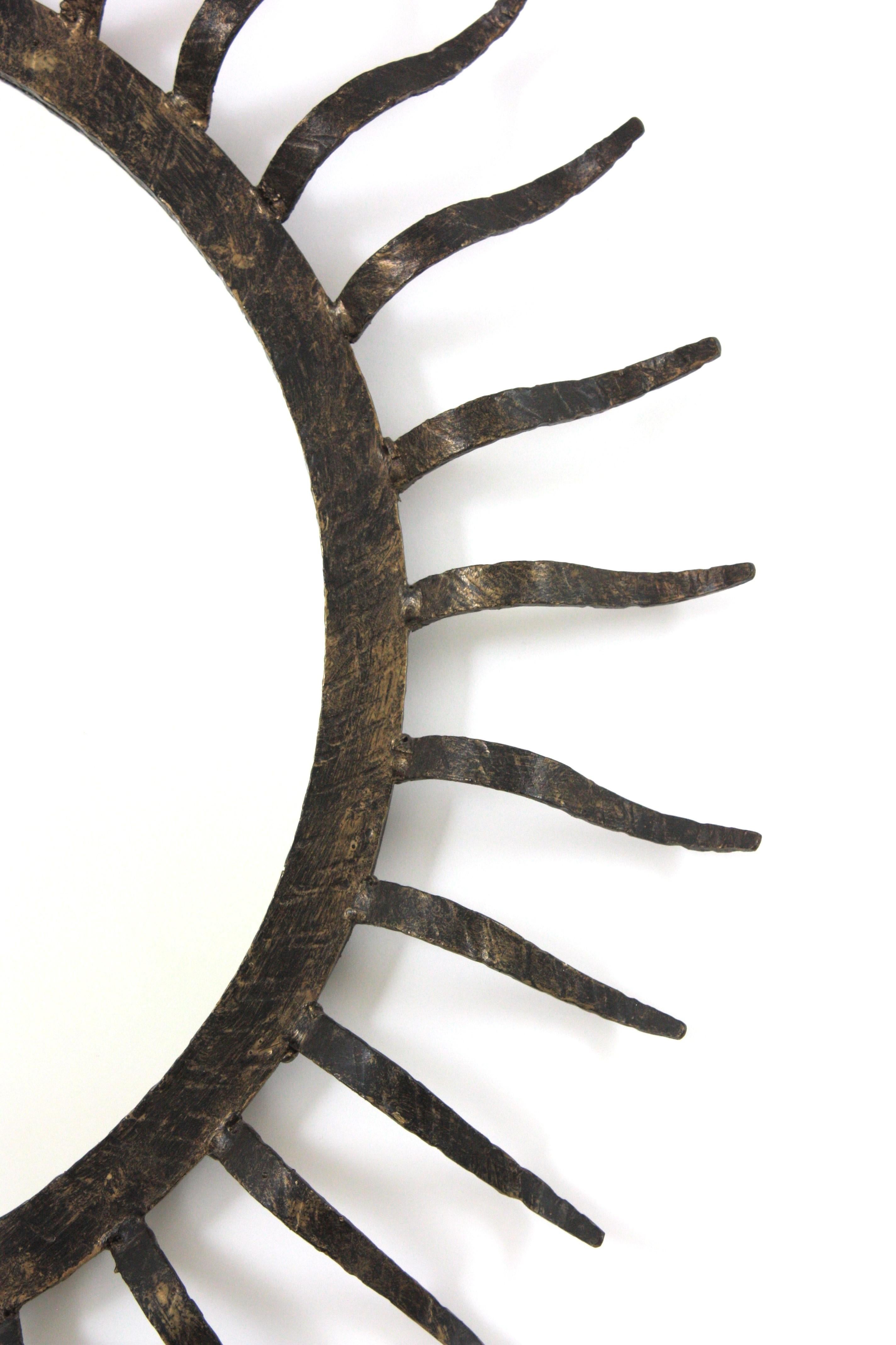 20th Century Parcel Gilt Sunburst Mirror in the Style of Gilbert Poillerat For Sale