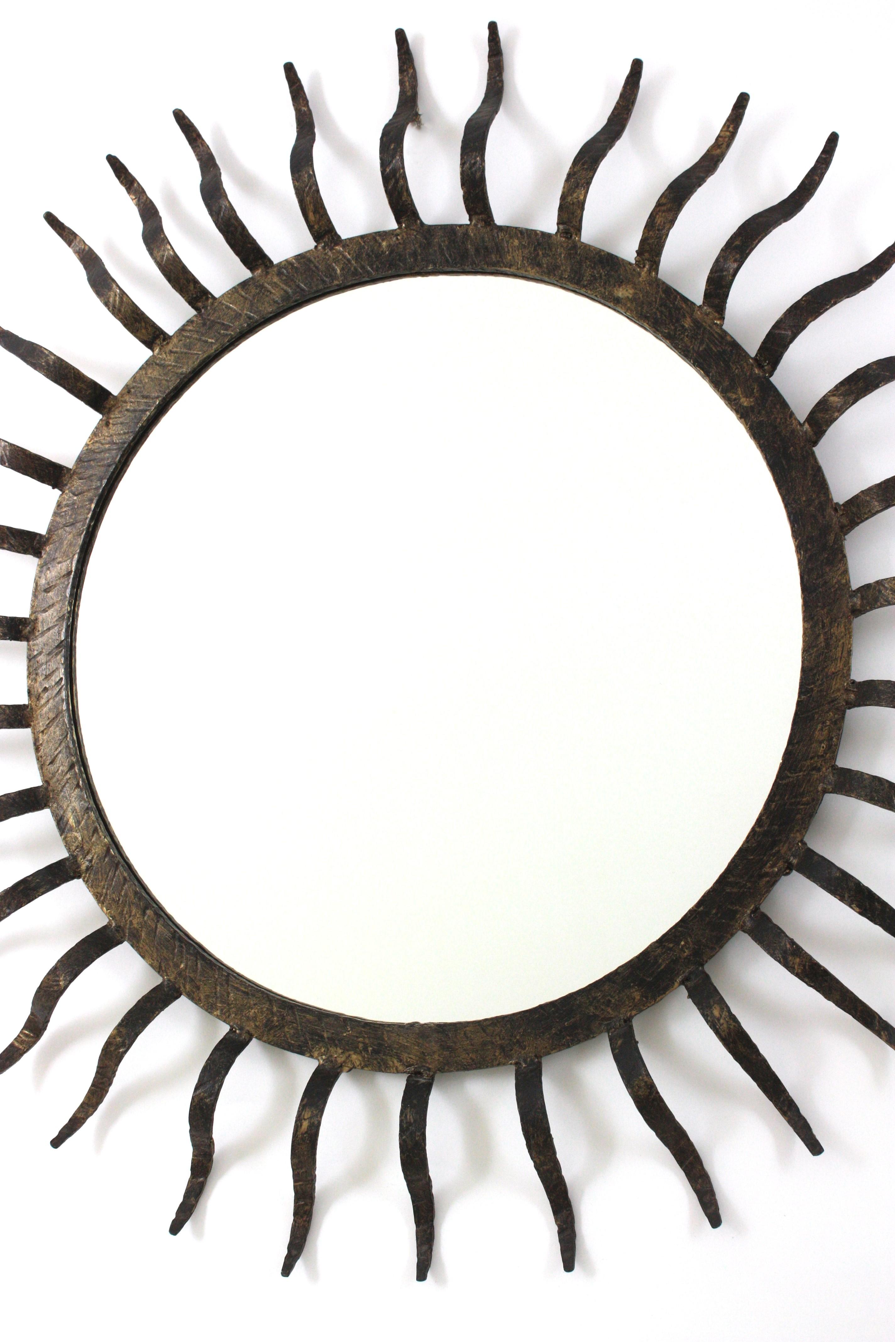 Metal Parcel Gilt Sunburst Mirror in the Style of Gilbert Poillerat For Sale