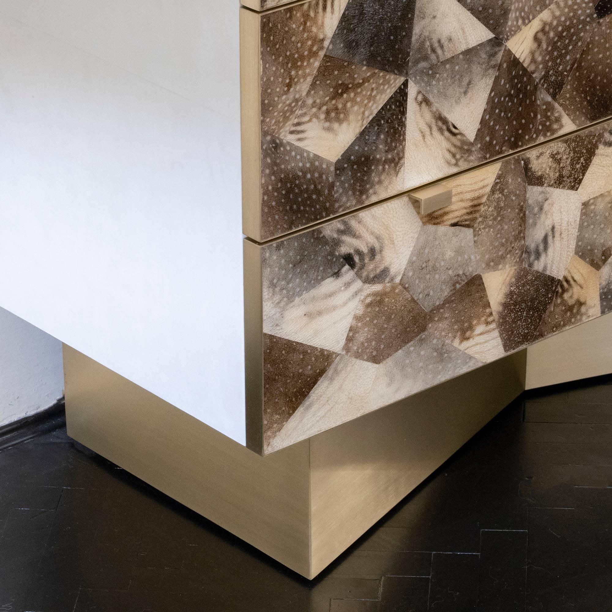 Contemporary wood chest of drawers or dresser covered in parchment and Fugu fish skin with brass details.