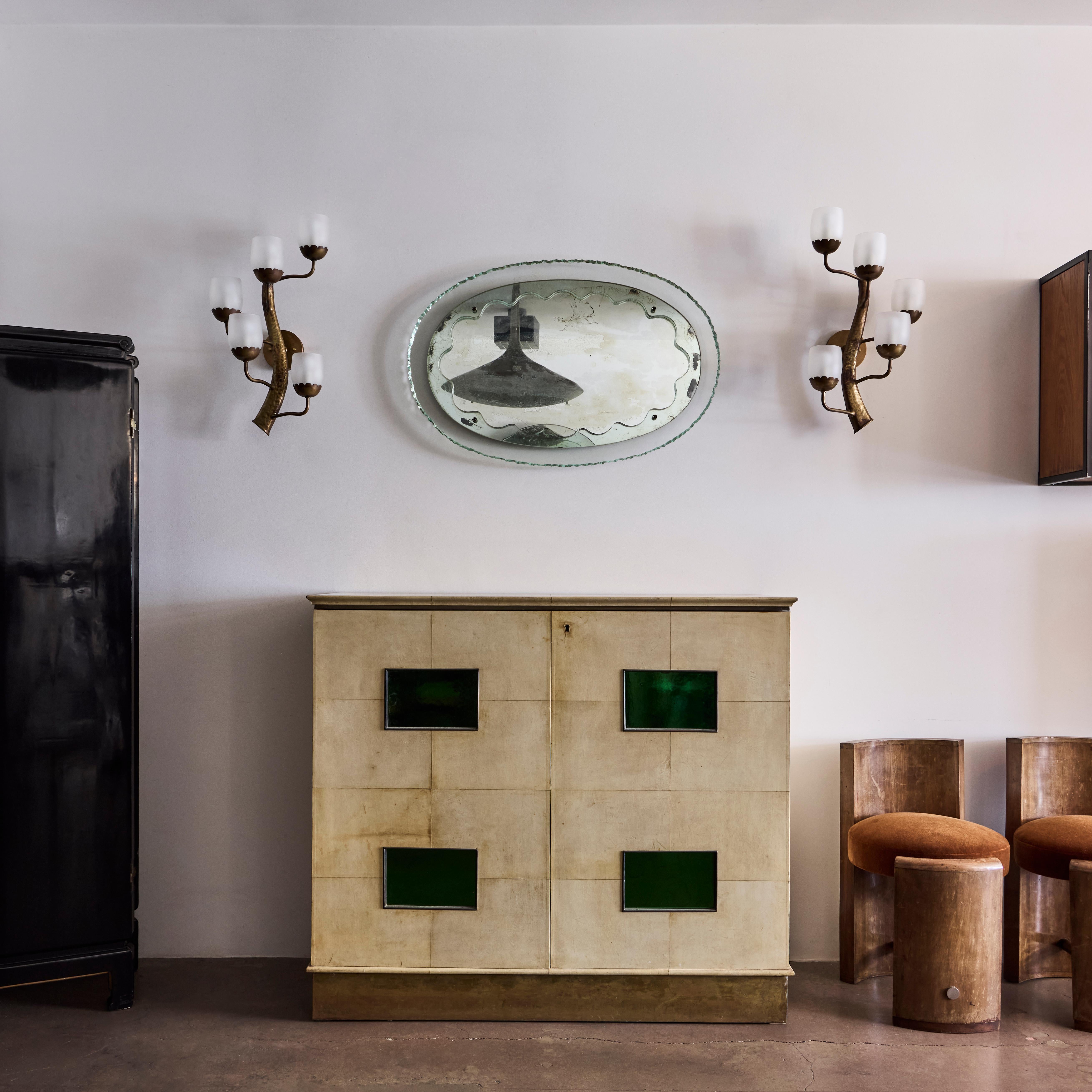 Parchment and mirrored green glass bar cabinet by Paolo Buffa with original key and Paolo Buffa archive certificate. Made in Italy circa 1940s.



