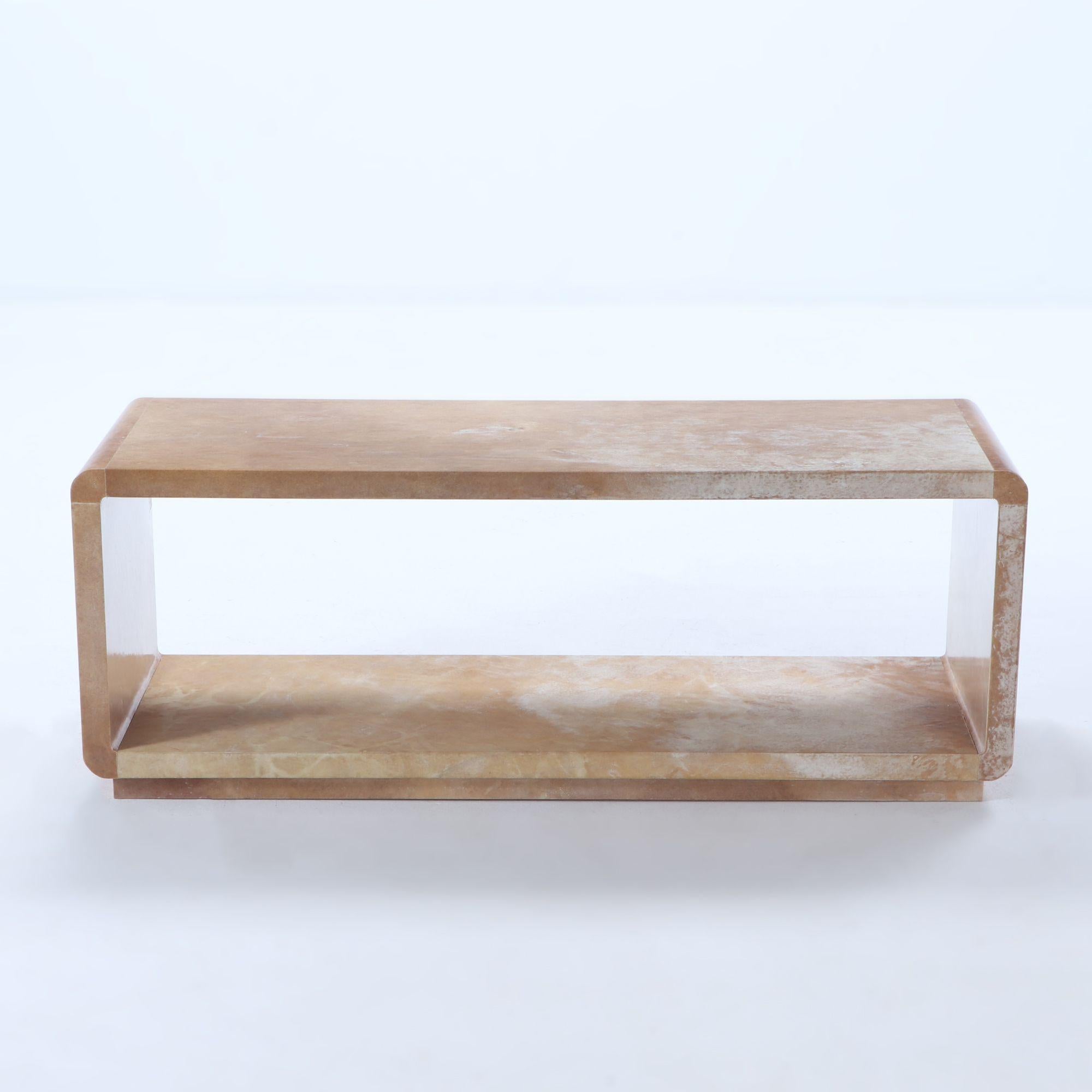 Parchment covered bench or coffee table with rounded corners done in an interesting brownish cream parchment.