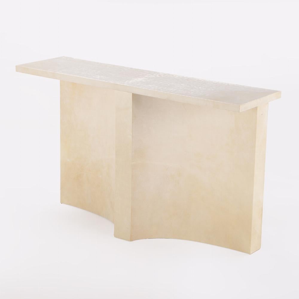 Parchment covered console table having a double concave design base. This table is made in our workshop and is available in custom sizes.
