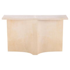 Parchment covered console table having a double concave design base.