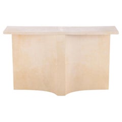 Parchment covered console table having a double concave design base.