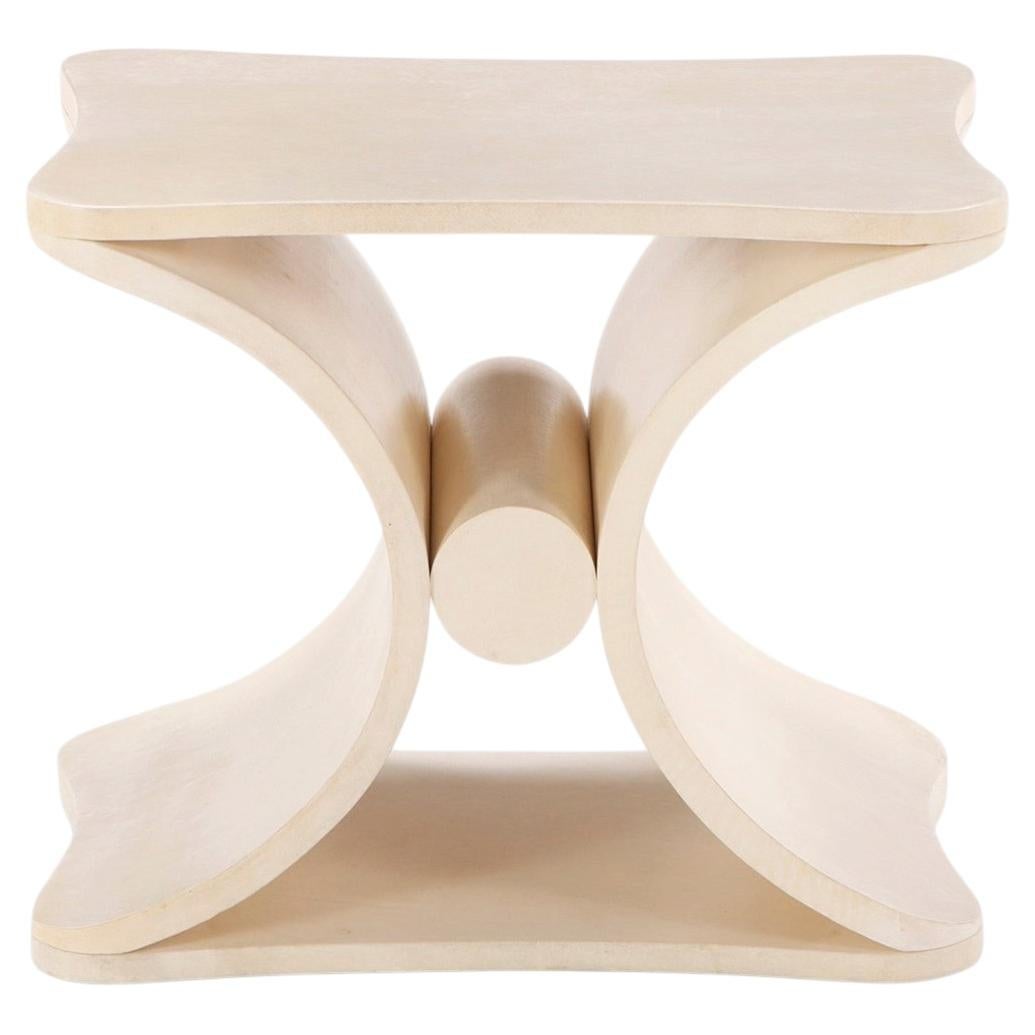 Parchment covered stool or end table.
