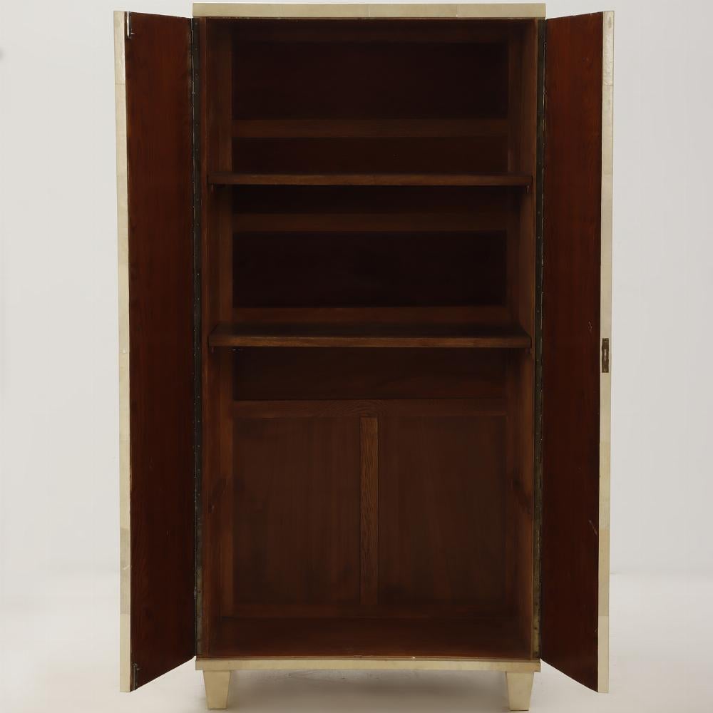 Mid-Century Modern Parchment covered two door cabinet C 1940 in the manner of Samuel Marx.  For Sale