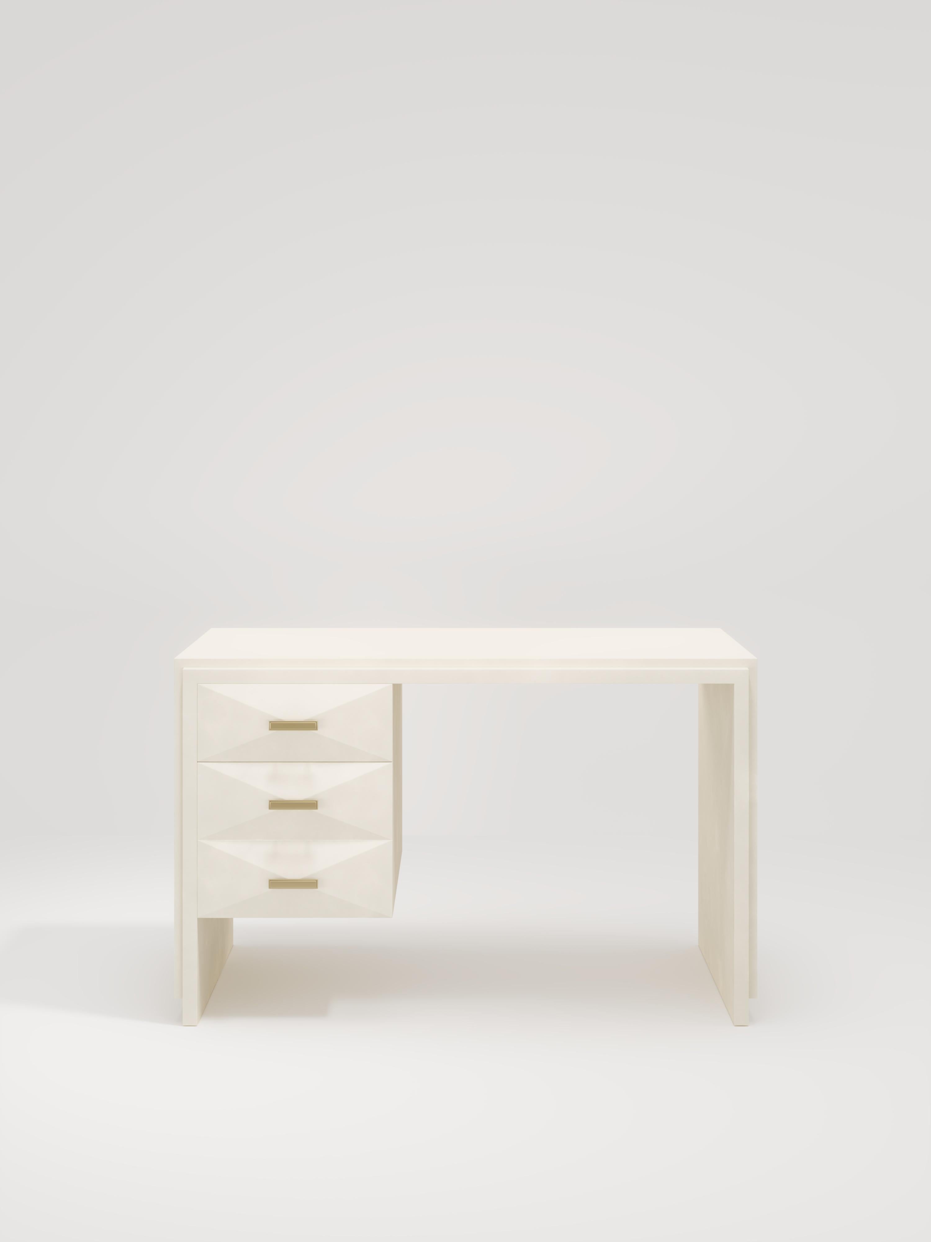 The Iconic Writing Desk is both elegant and minimalist with its classic aesthetic that showcases the purity of the beautiful Augousti craftsmanship. This piece is completely inlaid in cream parchment and includes 3 bevelled drawers on the left side