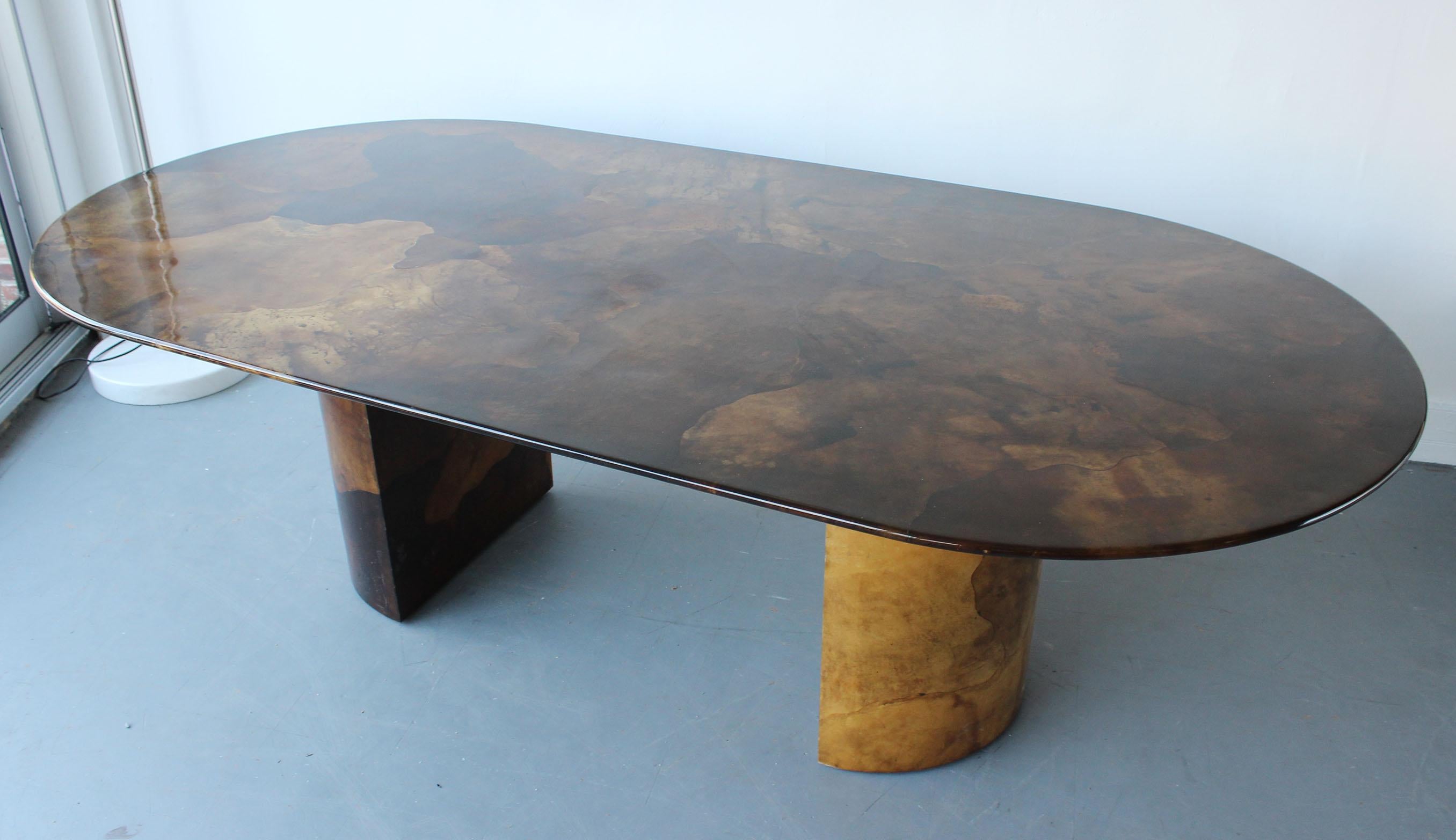 A classic, carmel colored parchment dining table in the manner of Karl Springer, circa 1980.