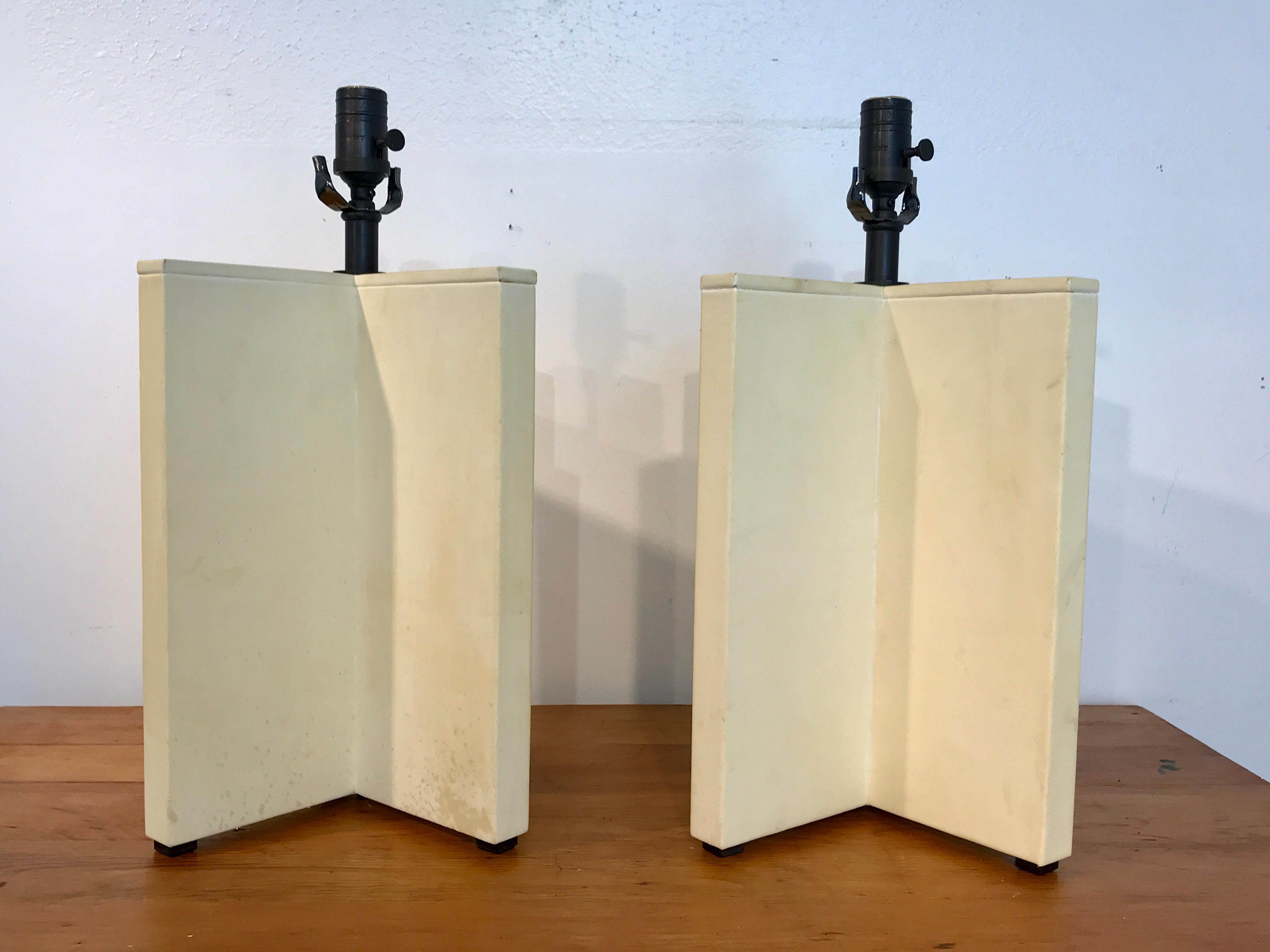 Parchment Leather Croisillon Lamps after Jean Michel Frank
A fine pair of Croisillon lamps in leather with beautiful aged patina and wear resembling parchment. Excellent quality raised on four bronze feet. Presents beautifully. Each lamp has a 12