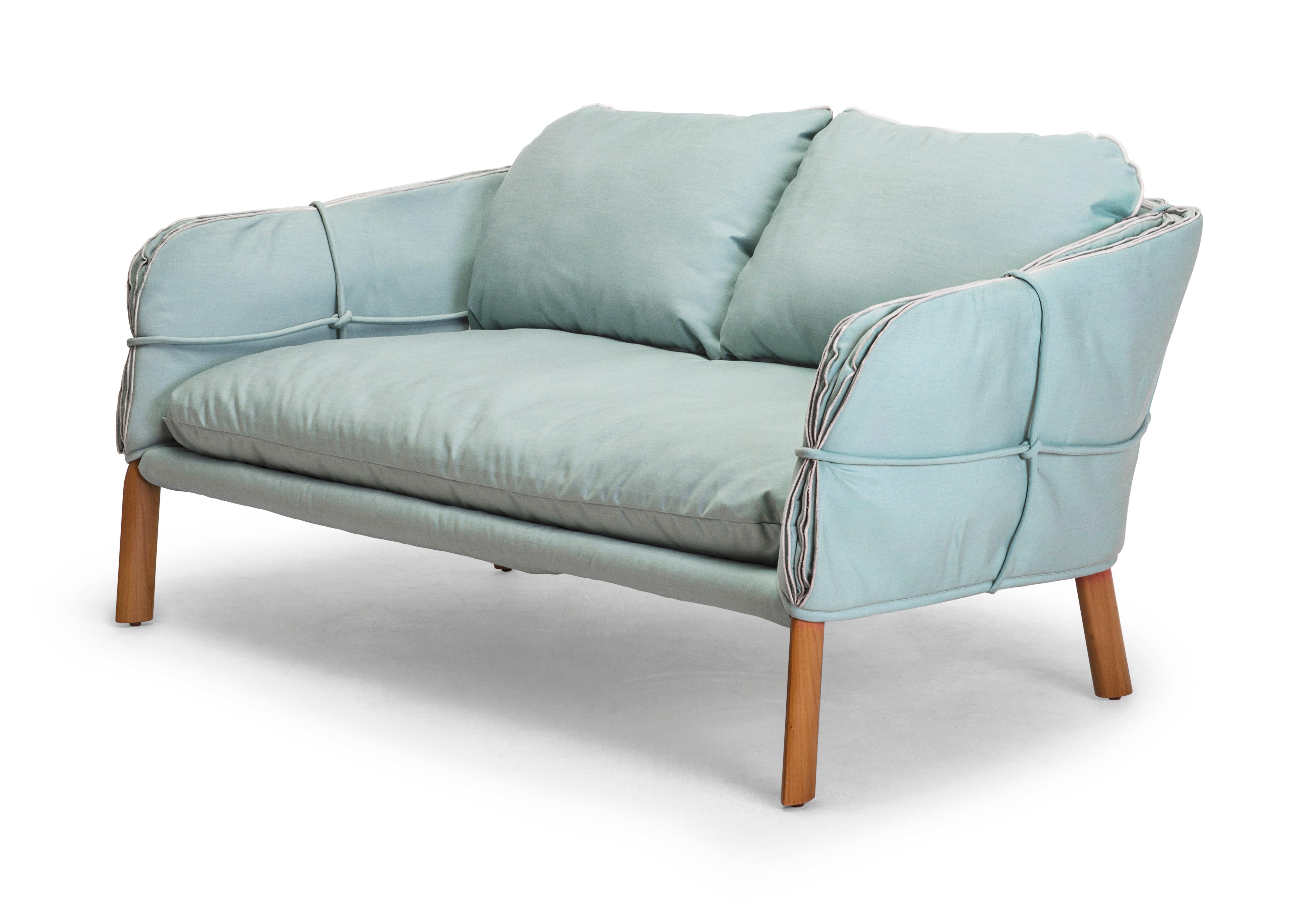 Parchment loveseat by Kenneth Cobonpue.
Materials: Maple, steel.
Also available in other colors.
Dimensions: 89 cm x 155.5 cm x H 78.5cm 

Inspired by bound manuscripts, the edges and surfaces of the Parchment collection imitate the natural